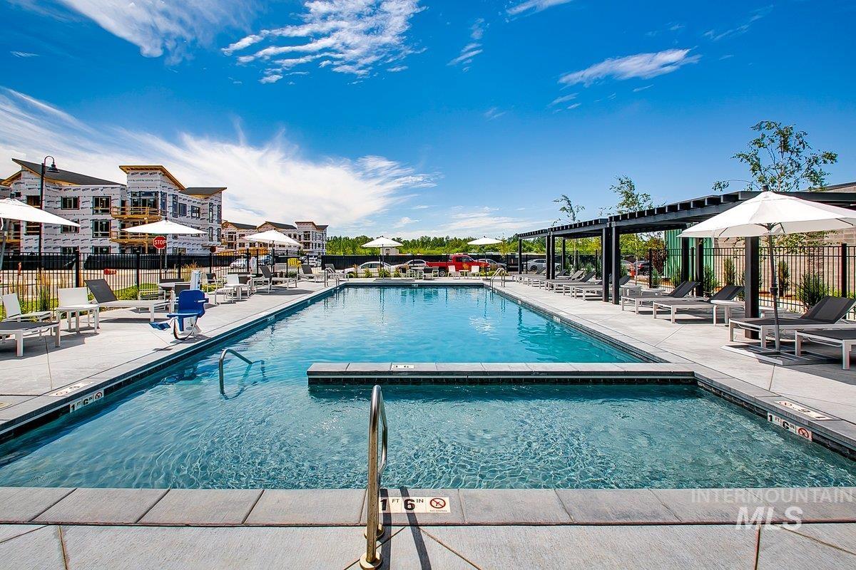 Community pool with a patio