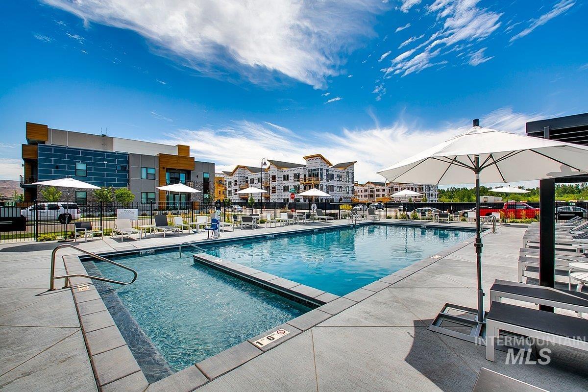 Community pool featuring a patio area