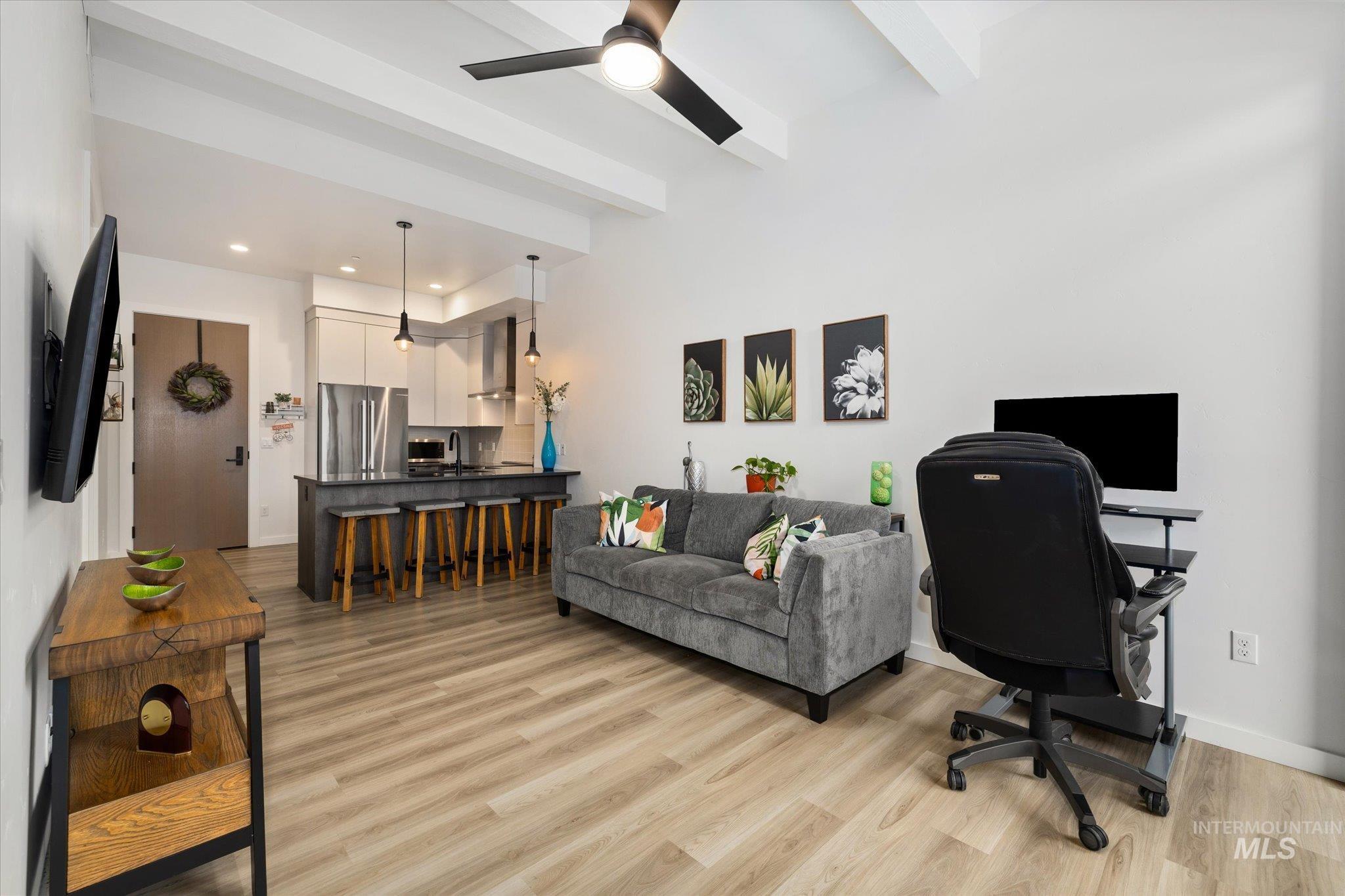 Office with ceiling fan, recessed lighting, beamed ceiling, and light wood-style flooring