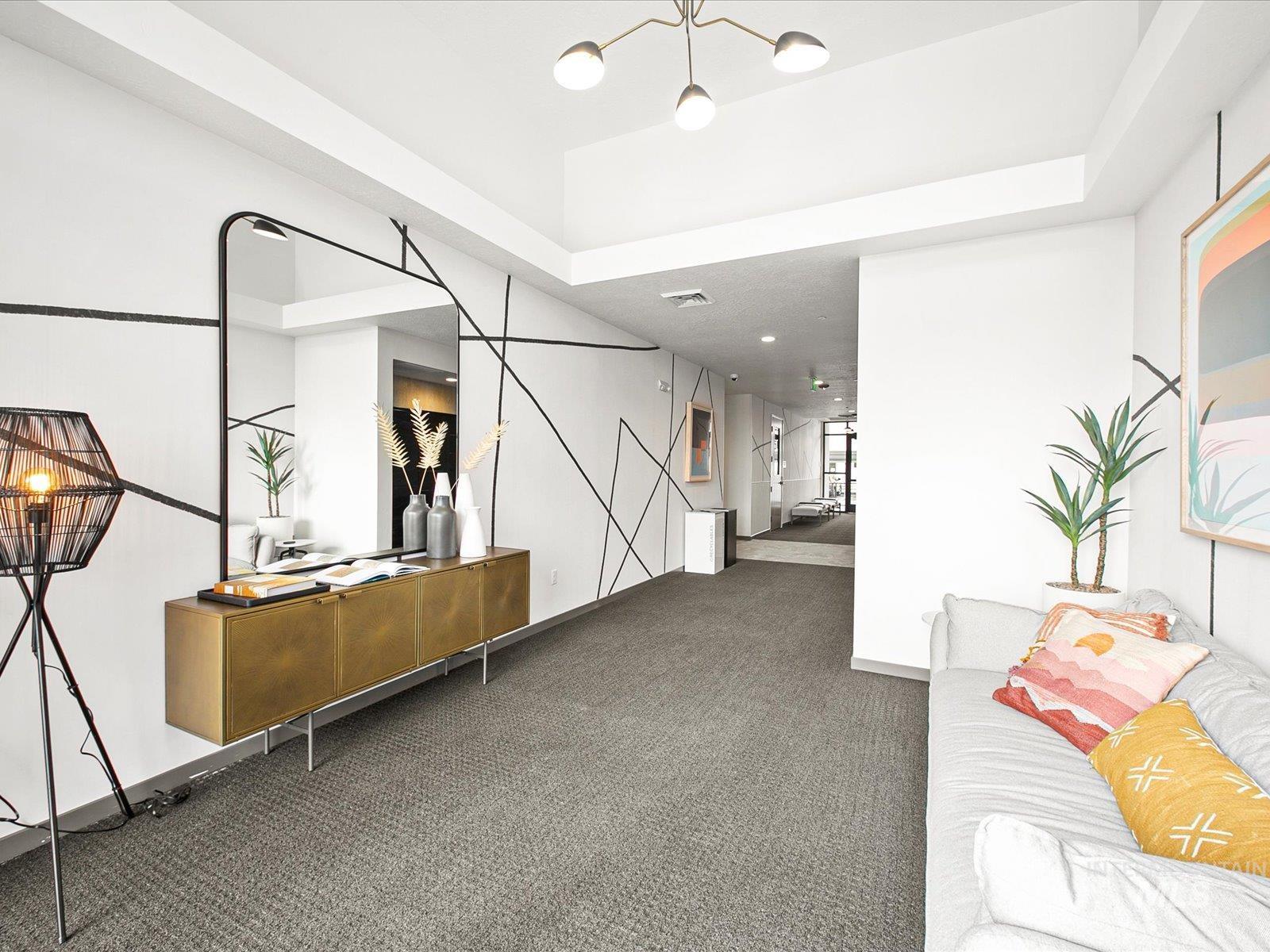 Unfurnished living room featuring carpet flooring