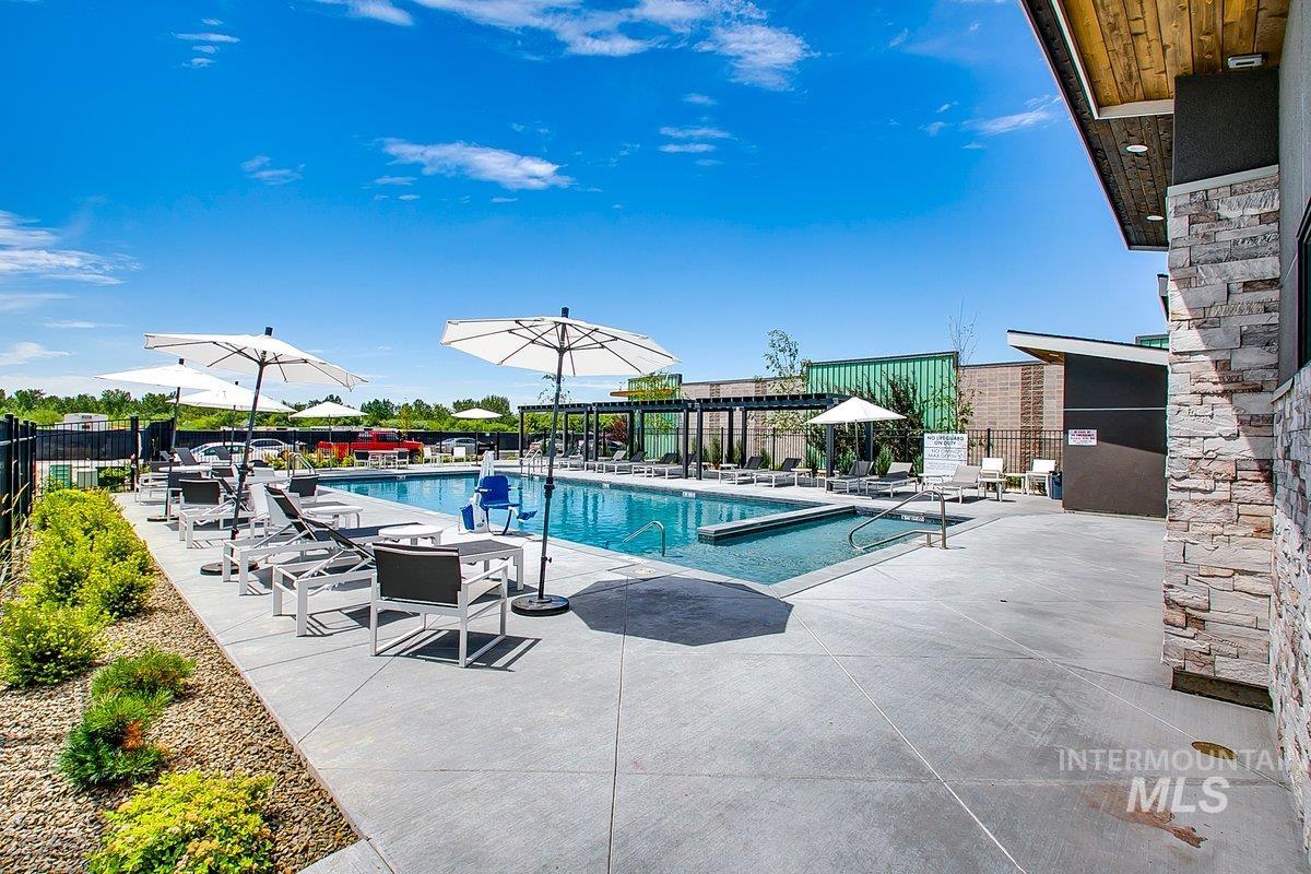 Community pool with a patio area