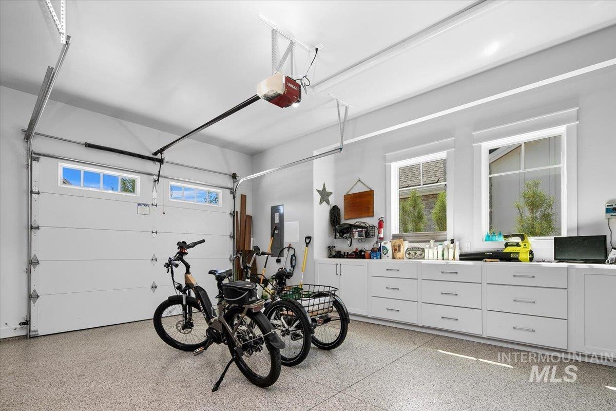 Garage with a garage door opener and electric panel