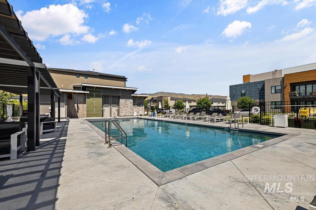 Community pool with a patio area