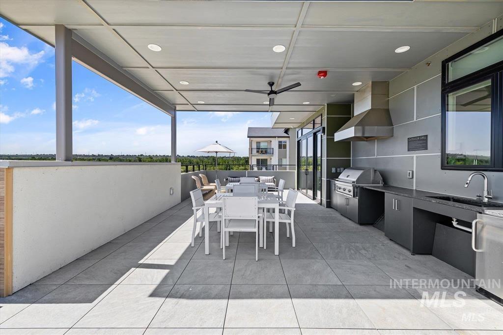 View of patio featuring outdoor dining space and exterior kitchen