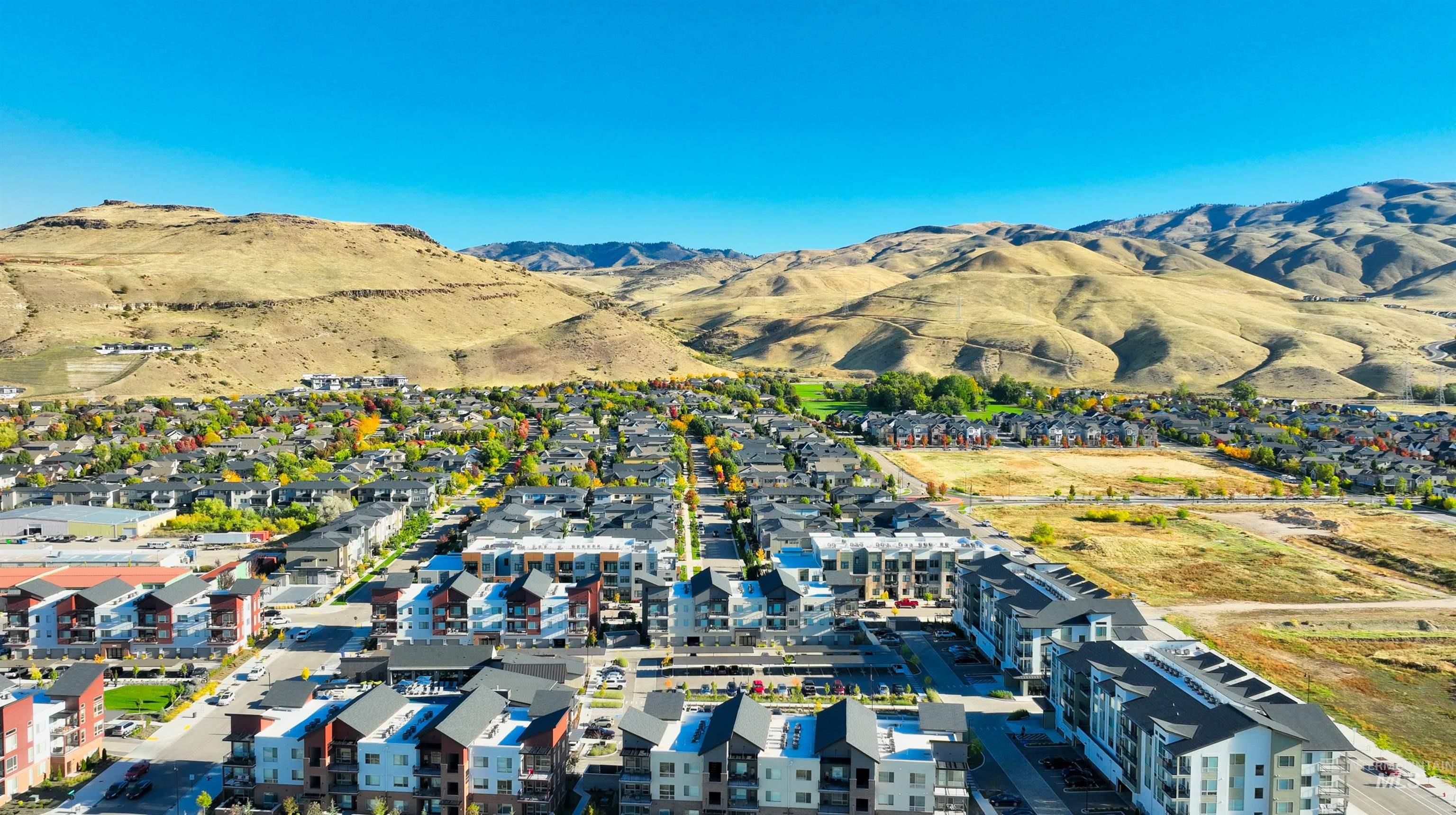 Aerial view of residential area with a mountainous background
