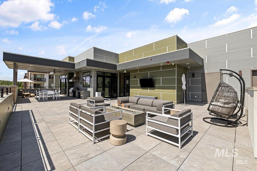 View of patio / terrace with outdoor dining space, outdoor lounge area, a ceiling fan, and grilling area