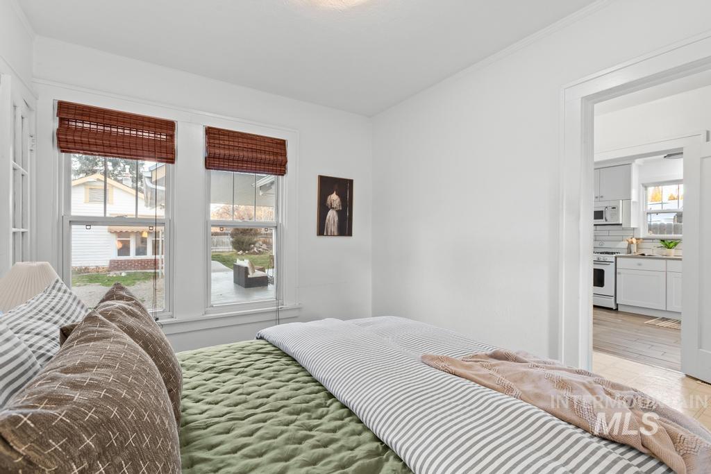 Bedroom with multiple windows