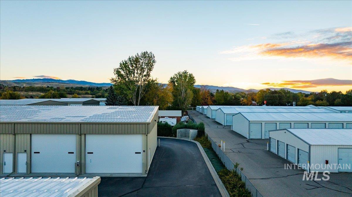 Exterior space featuring a mountainous background and a metal roof