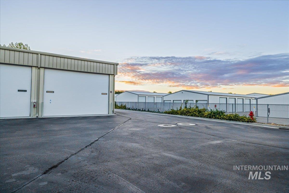 View of garage at dusk