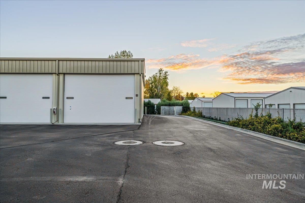 View of garage at dusk