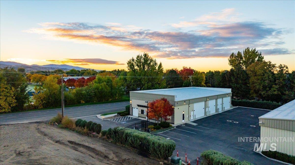 View of property at dusk