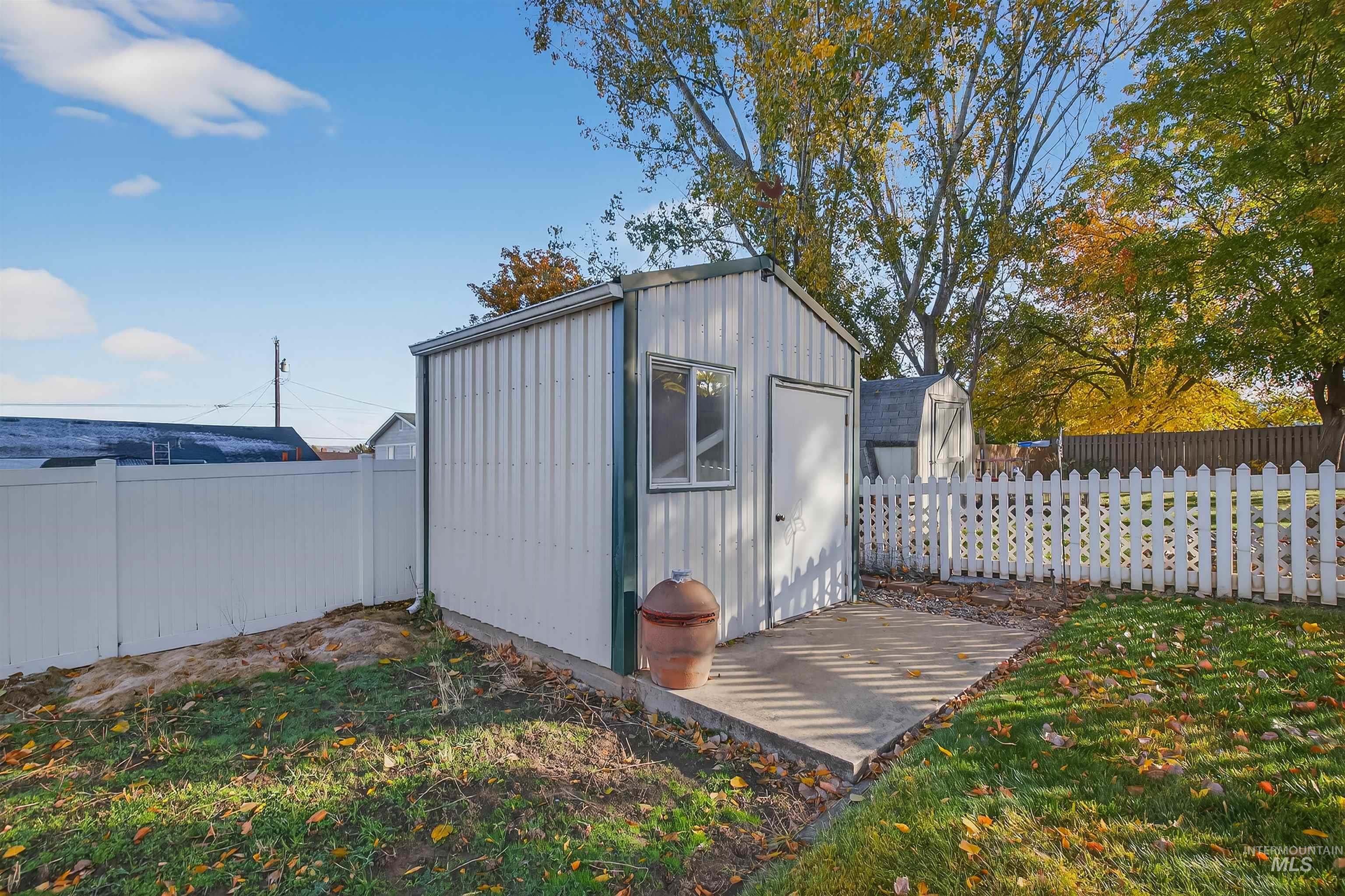 View of shed featuring a fenced backyard