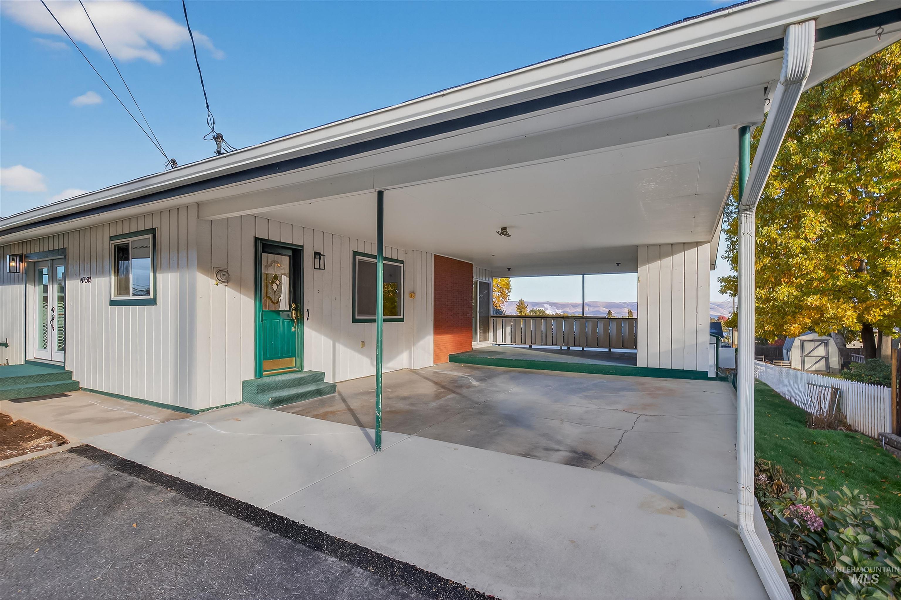 View of front of home featuring an attached carport