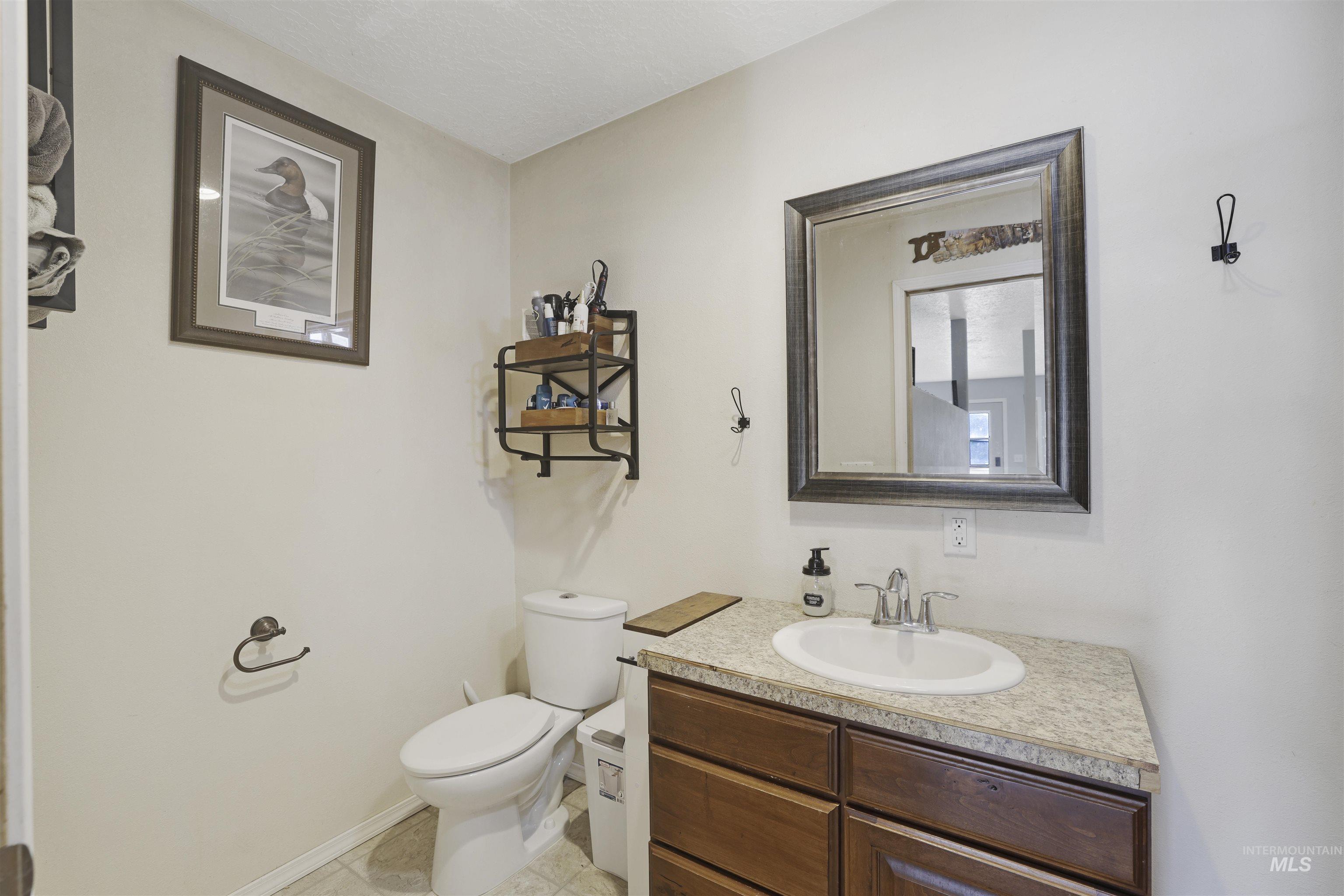 Bathroom with vanity and light tile patterned floors