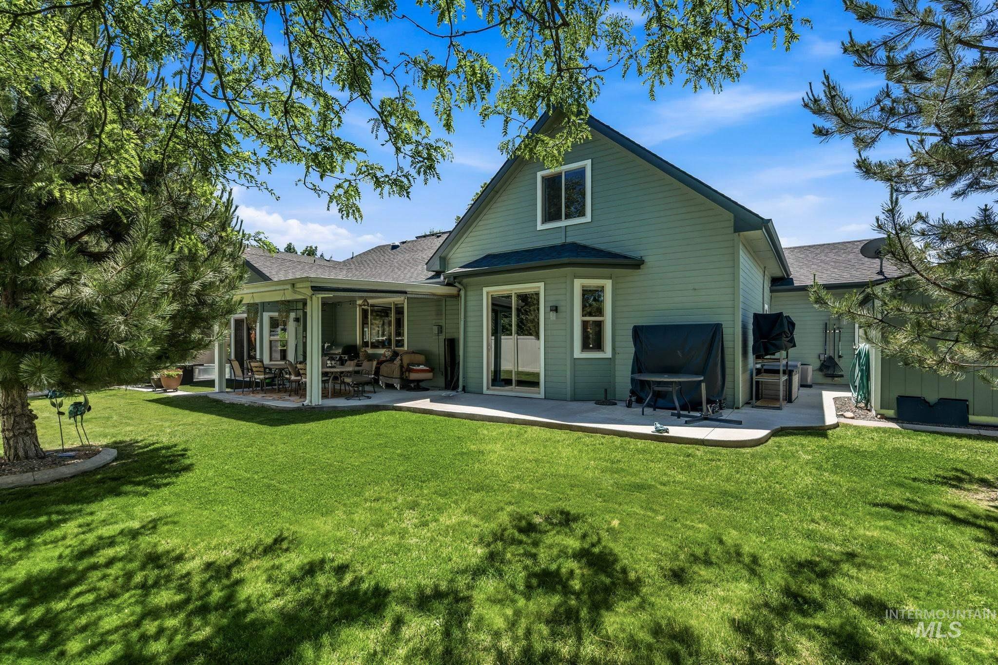 Expansive backyard featuring a lush lawn