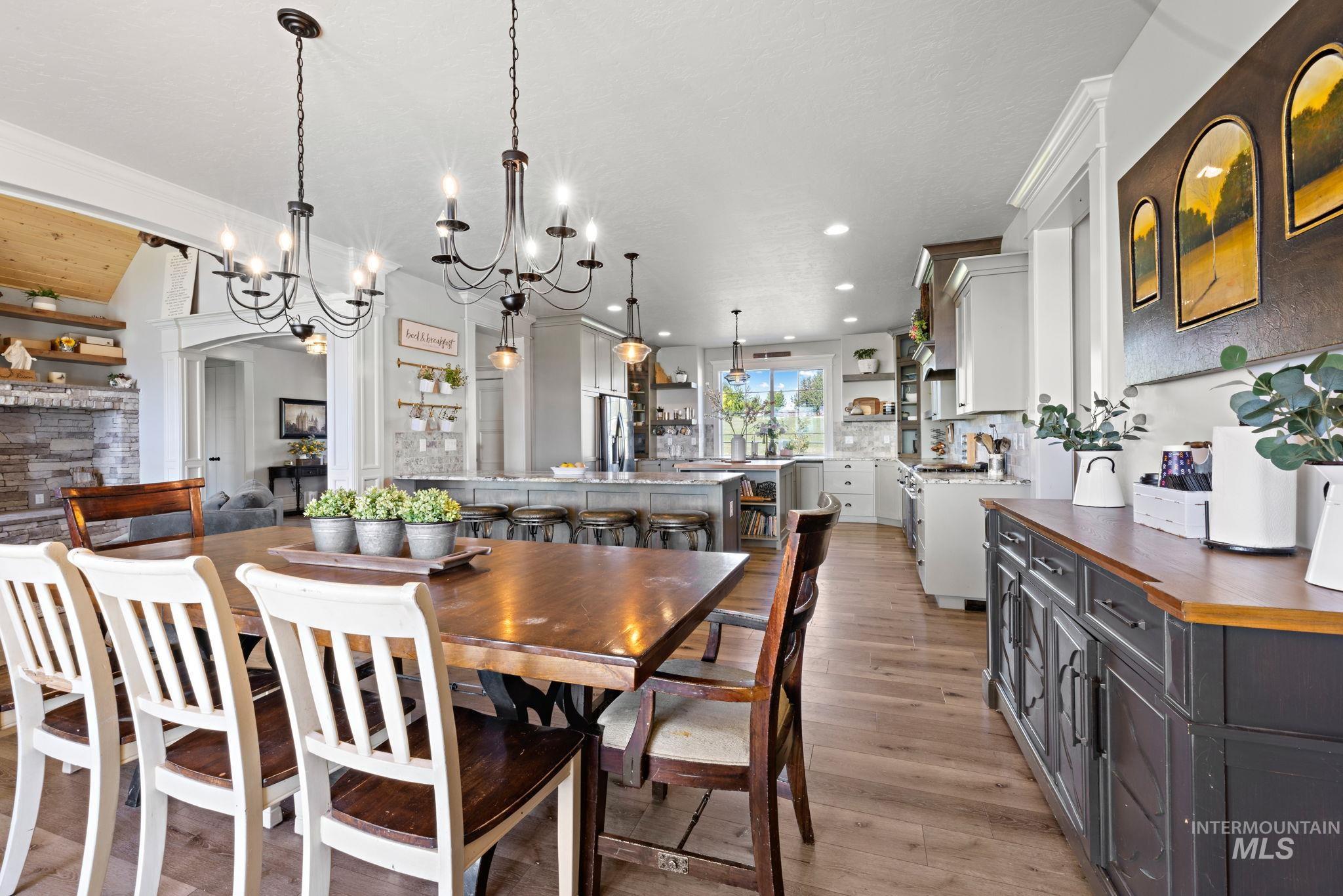 Dining room featuring light wood-style floors and a chandelier