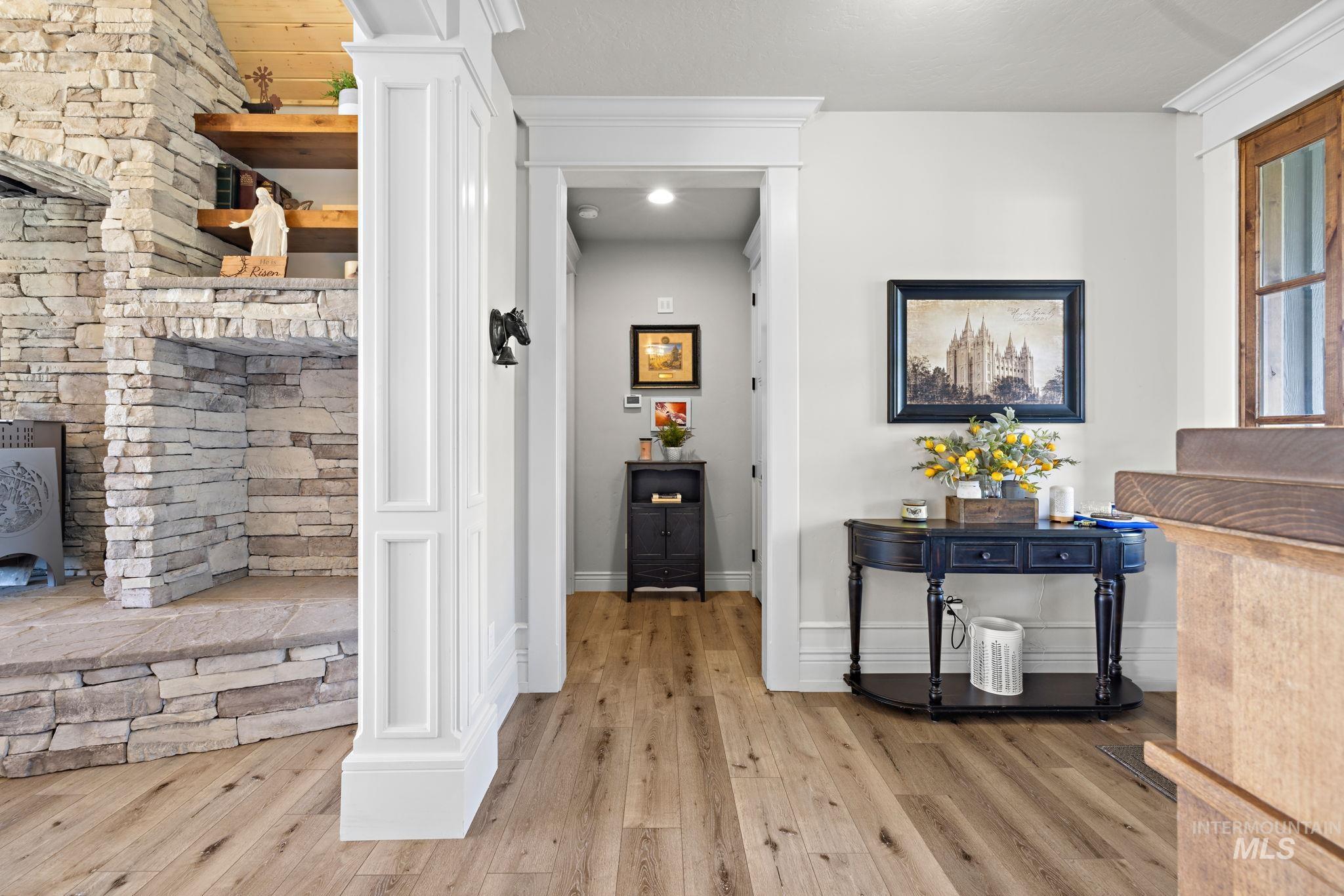 Hall featuring light wood-style flooring and baseboards