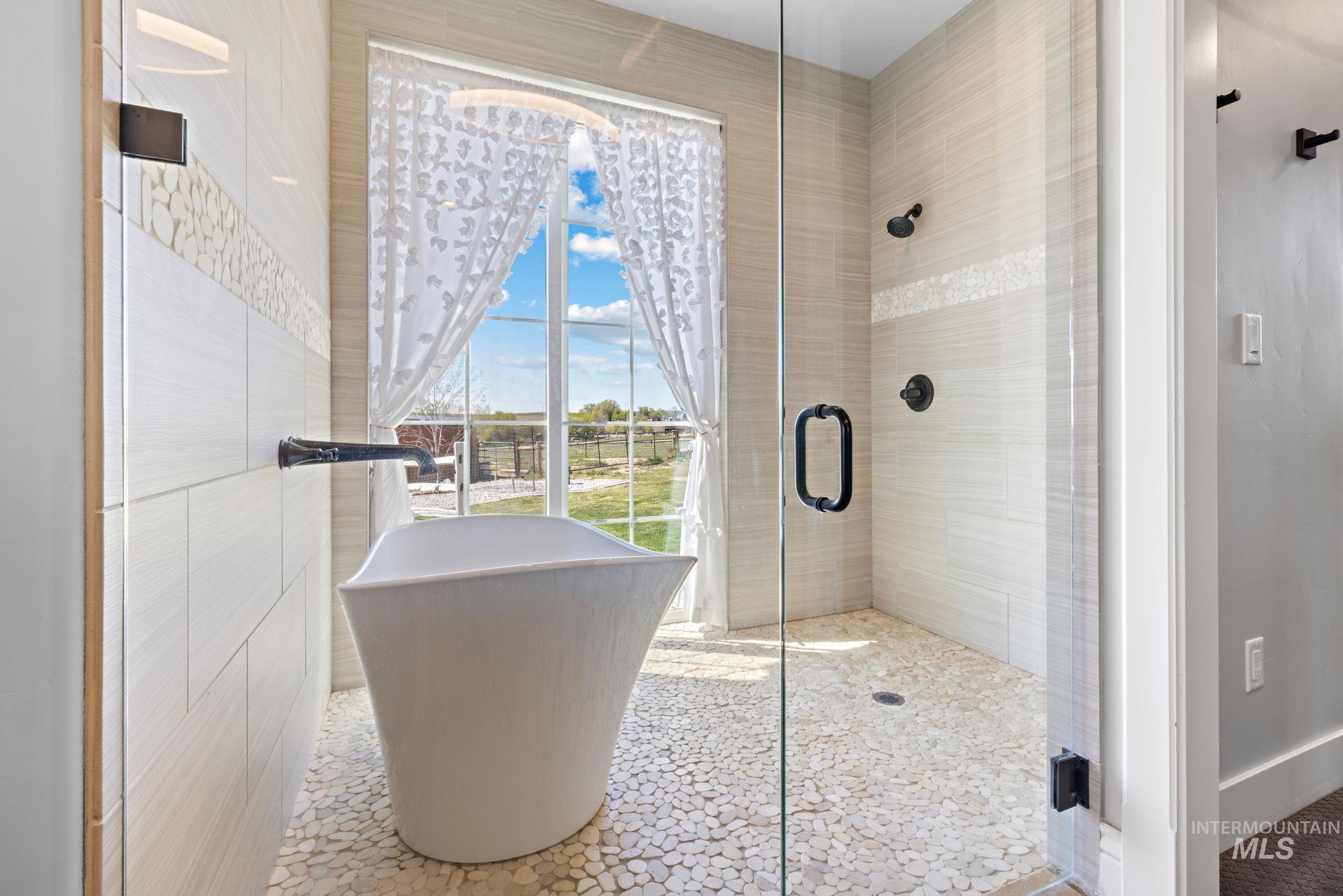 Full bathroom with a freestanding tub/shower