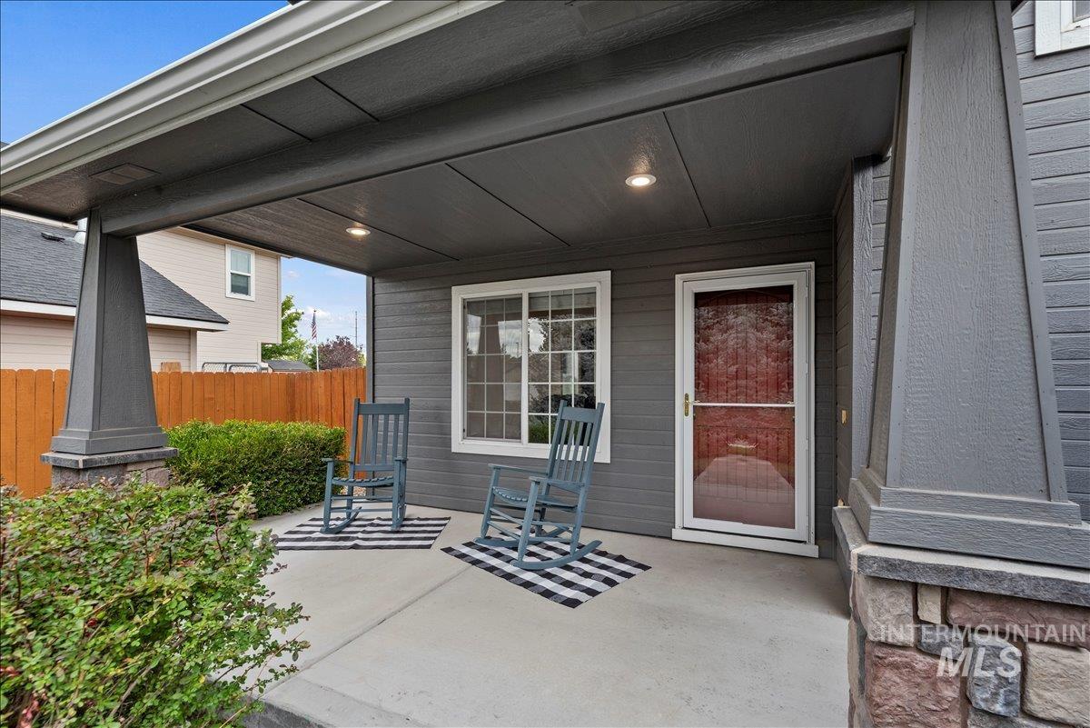 Doorway to property featuring a patio