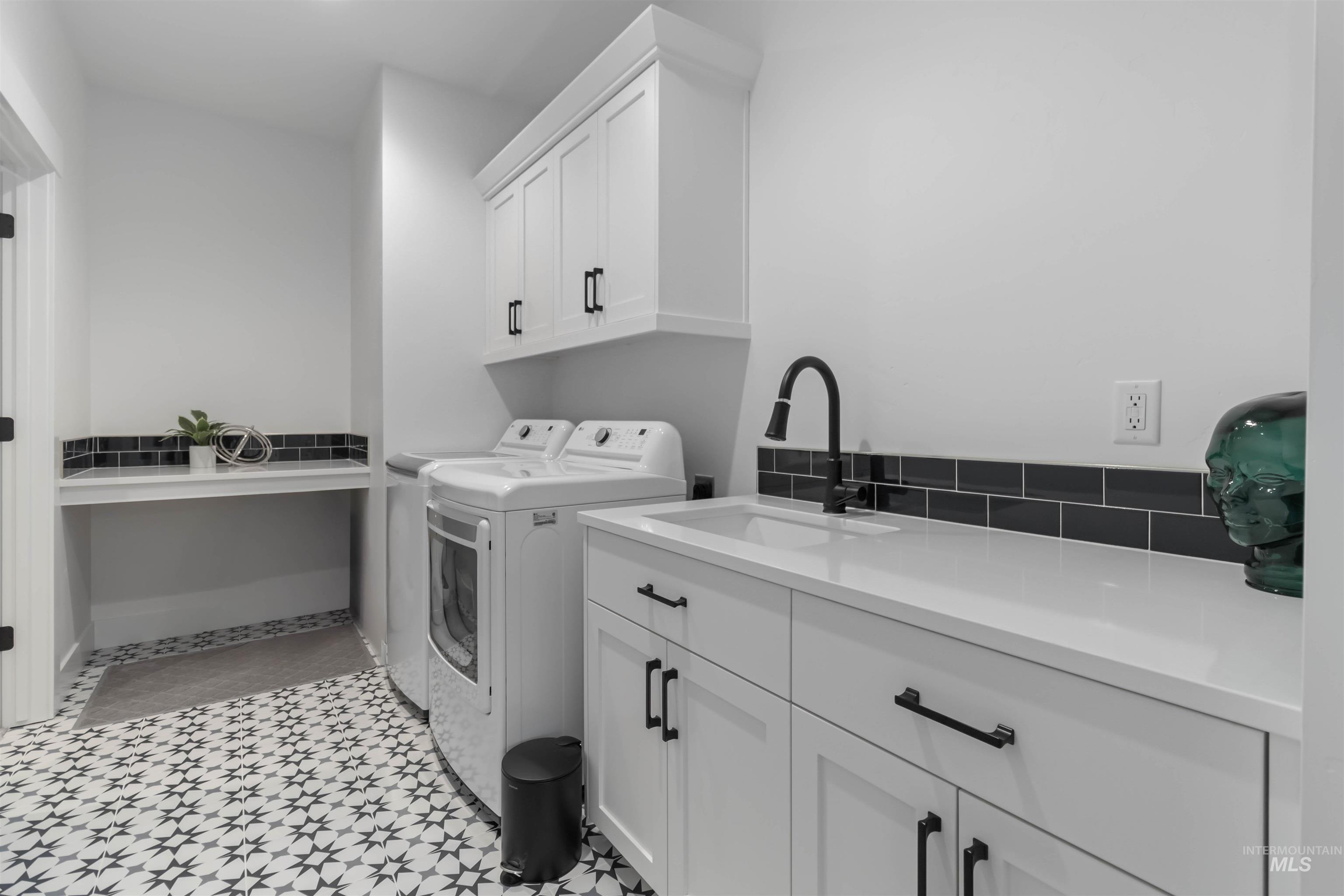 Laundry room with washing machine and dryer and cabinet space