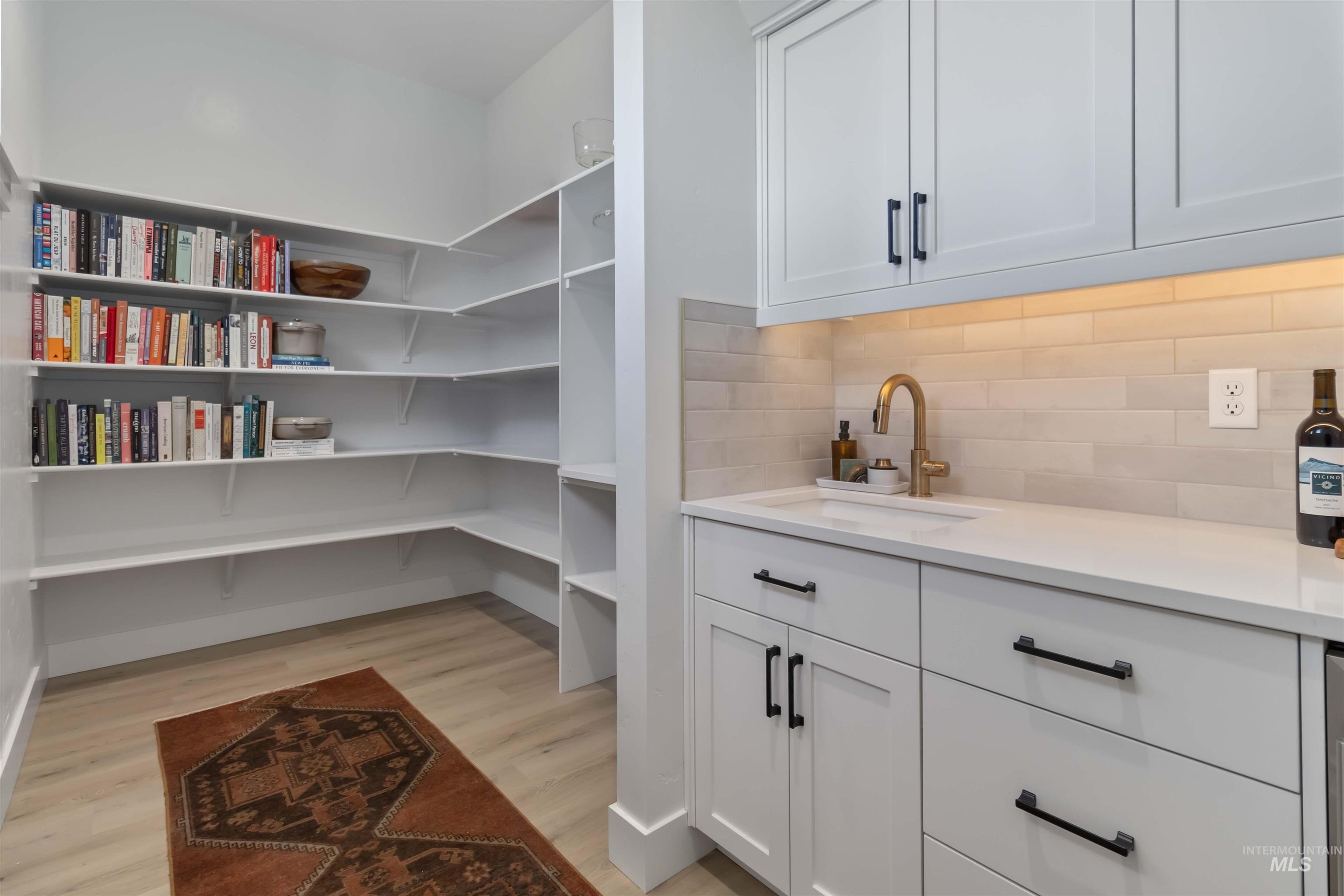 Storage area featuring a sink