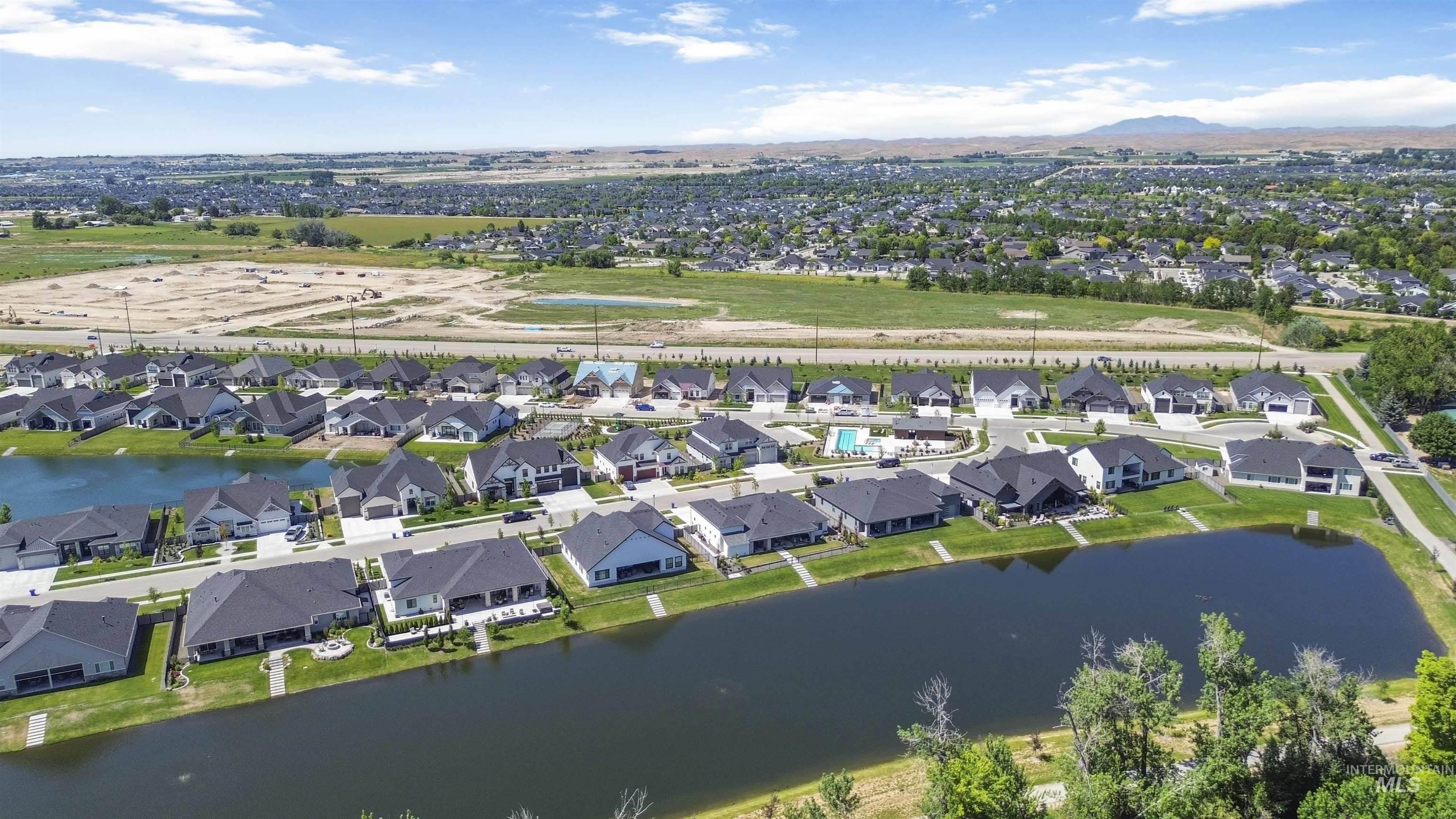 Aerial perspective of suburban area with a mountainous background