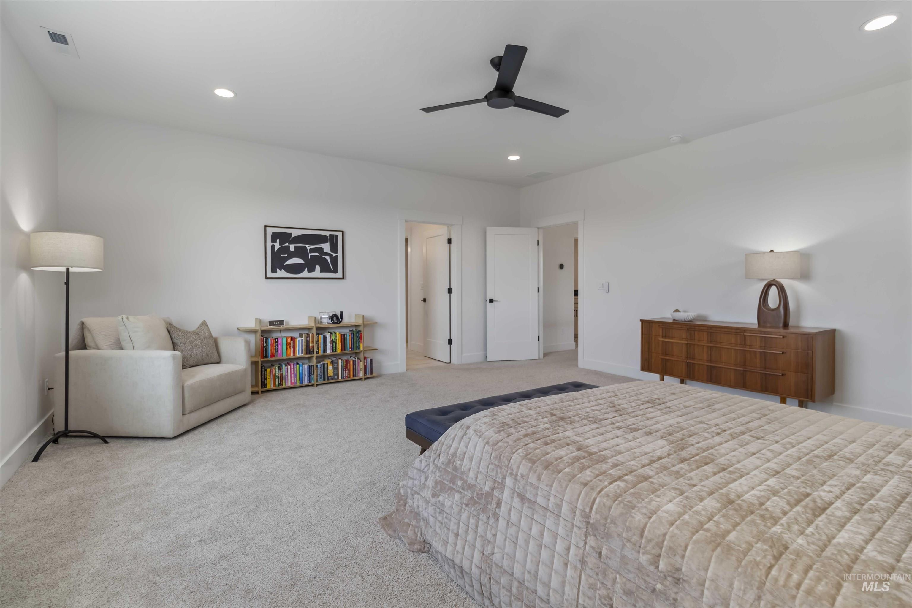 Bedroom featuring recessed lighting, ceiling fan, and carpet flooring