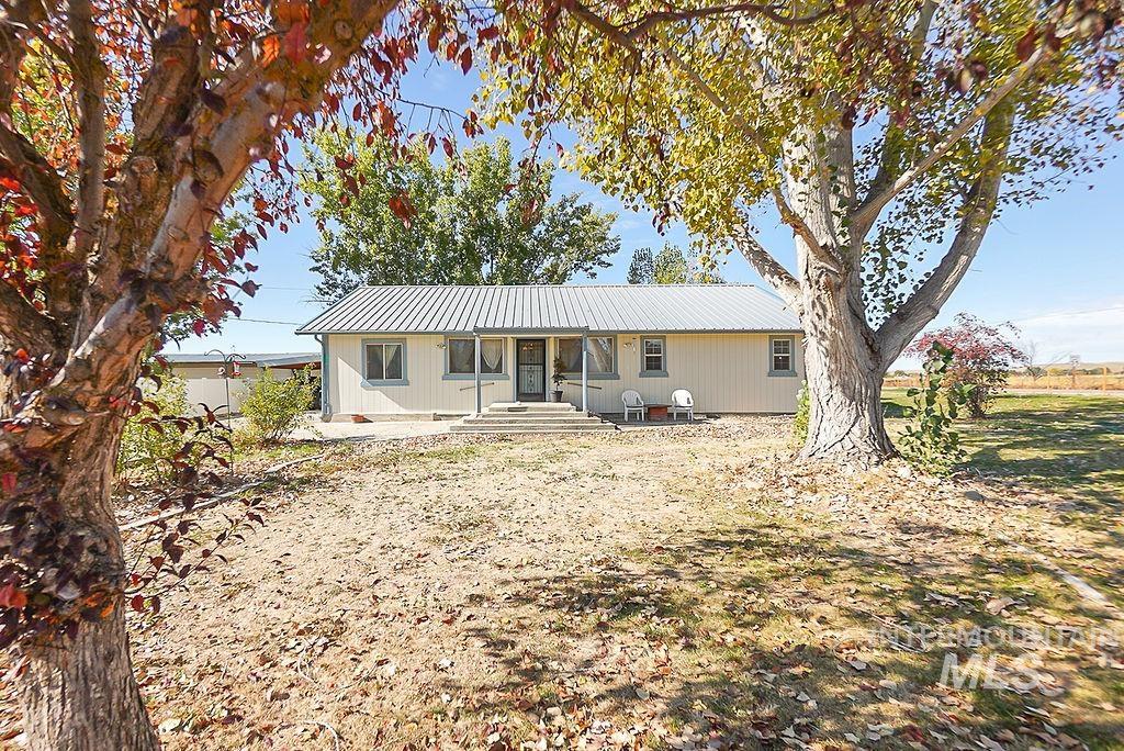Back of house featuring a metal roof