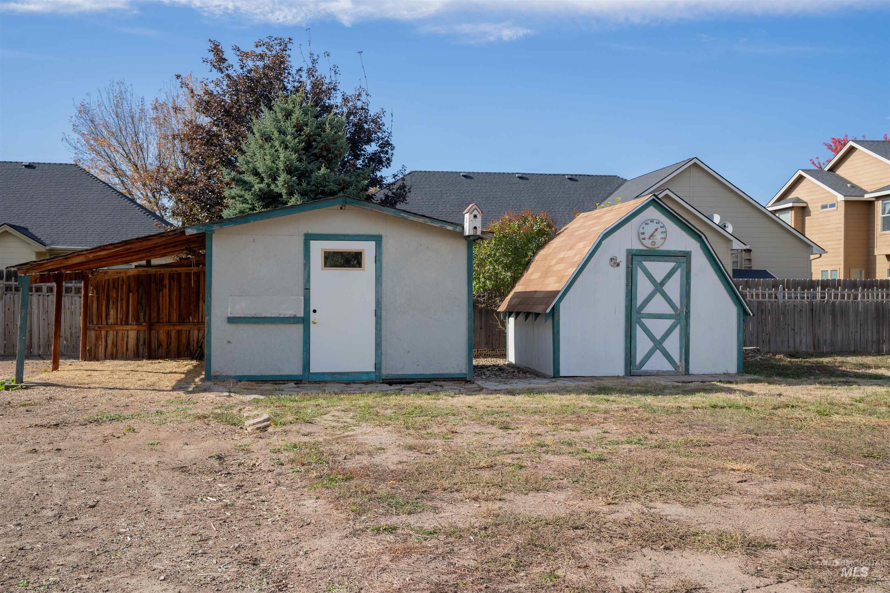 View of shed with a fenced backyard