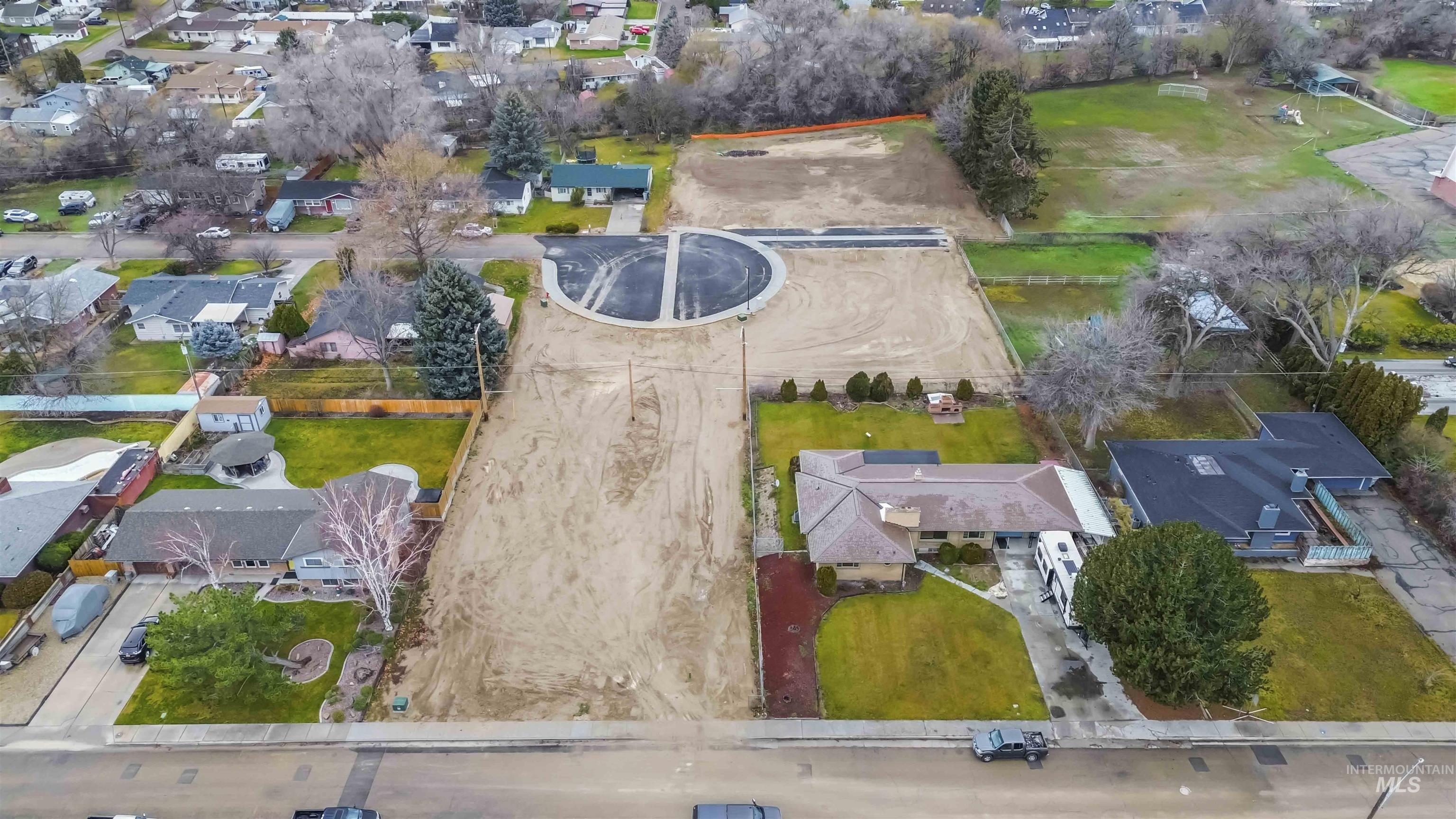Aerial view of property's location with nearby suburban area