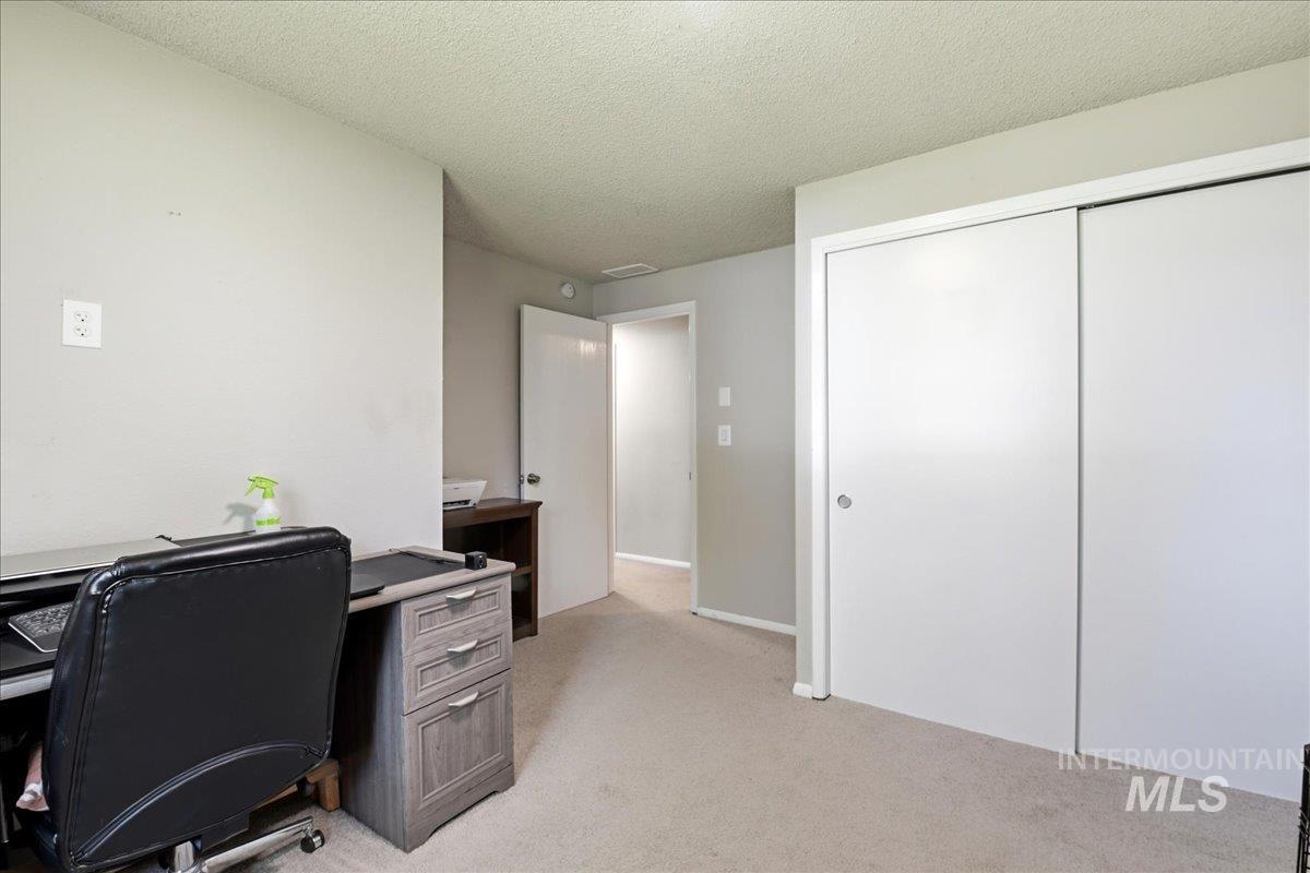 Light gray wall tones with light carpet flooring
