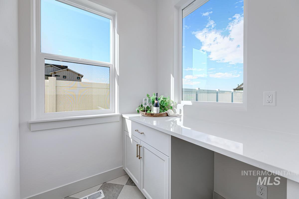 Bathroom featuring vanity and light tile patterned flooring