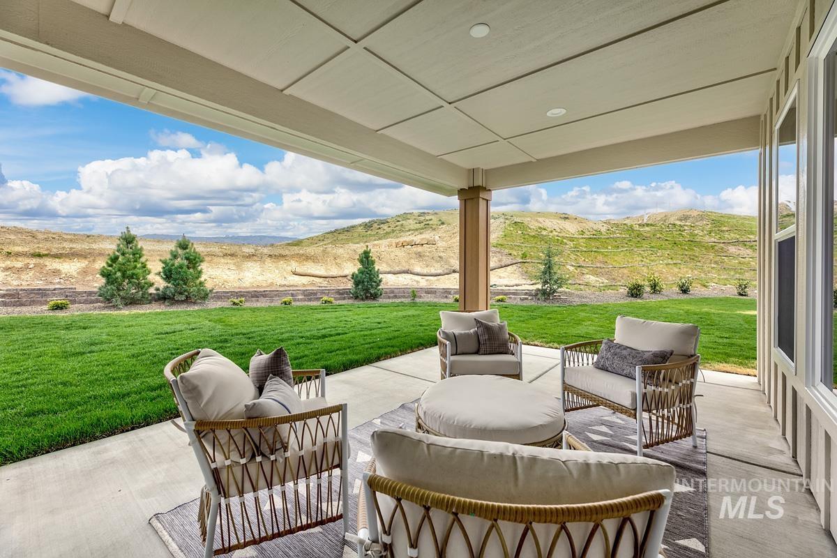 View of patio / terrace with an outdoor hangout area and a mountain view