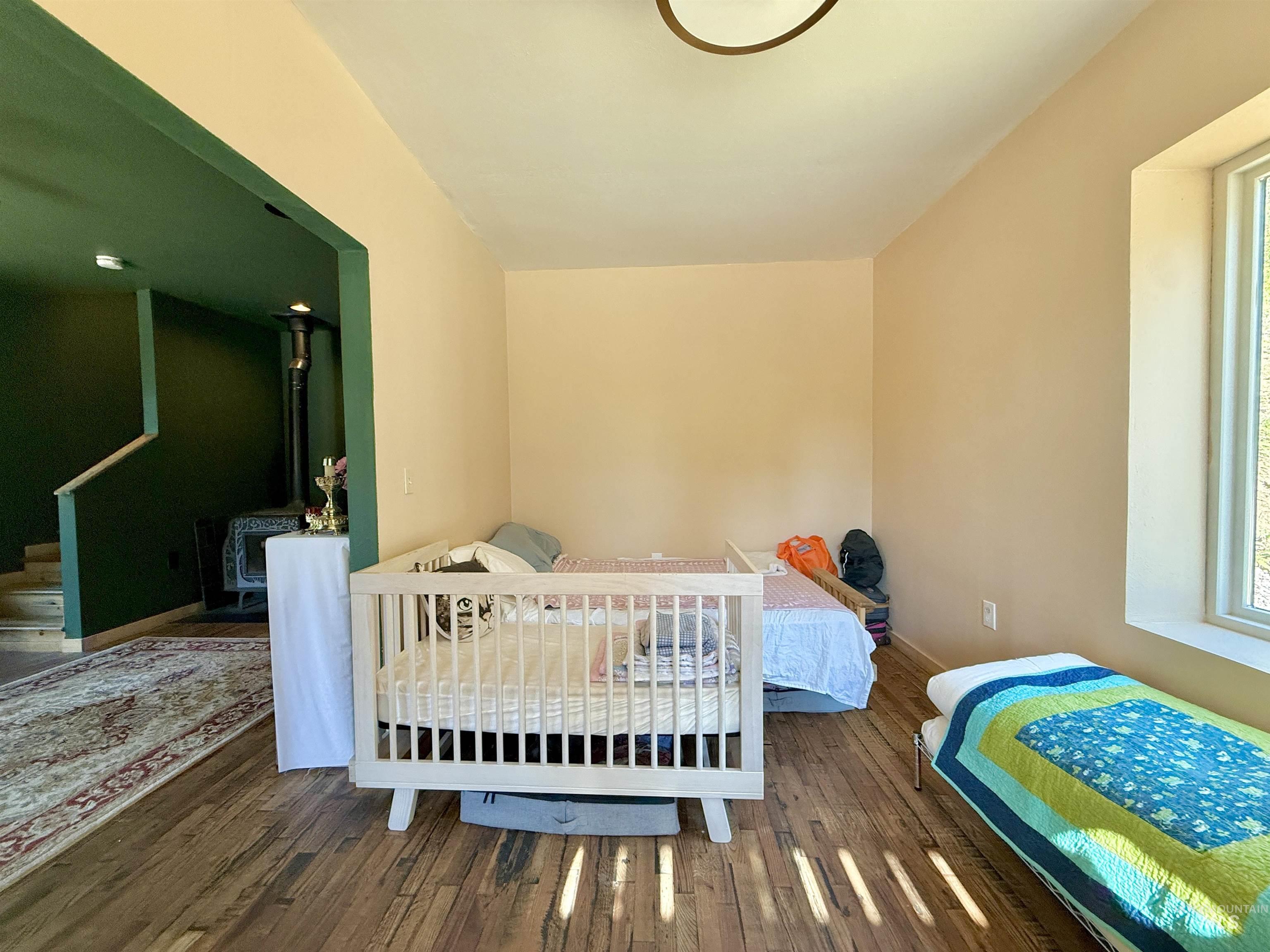Bedroom featuring wood-type flooring
