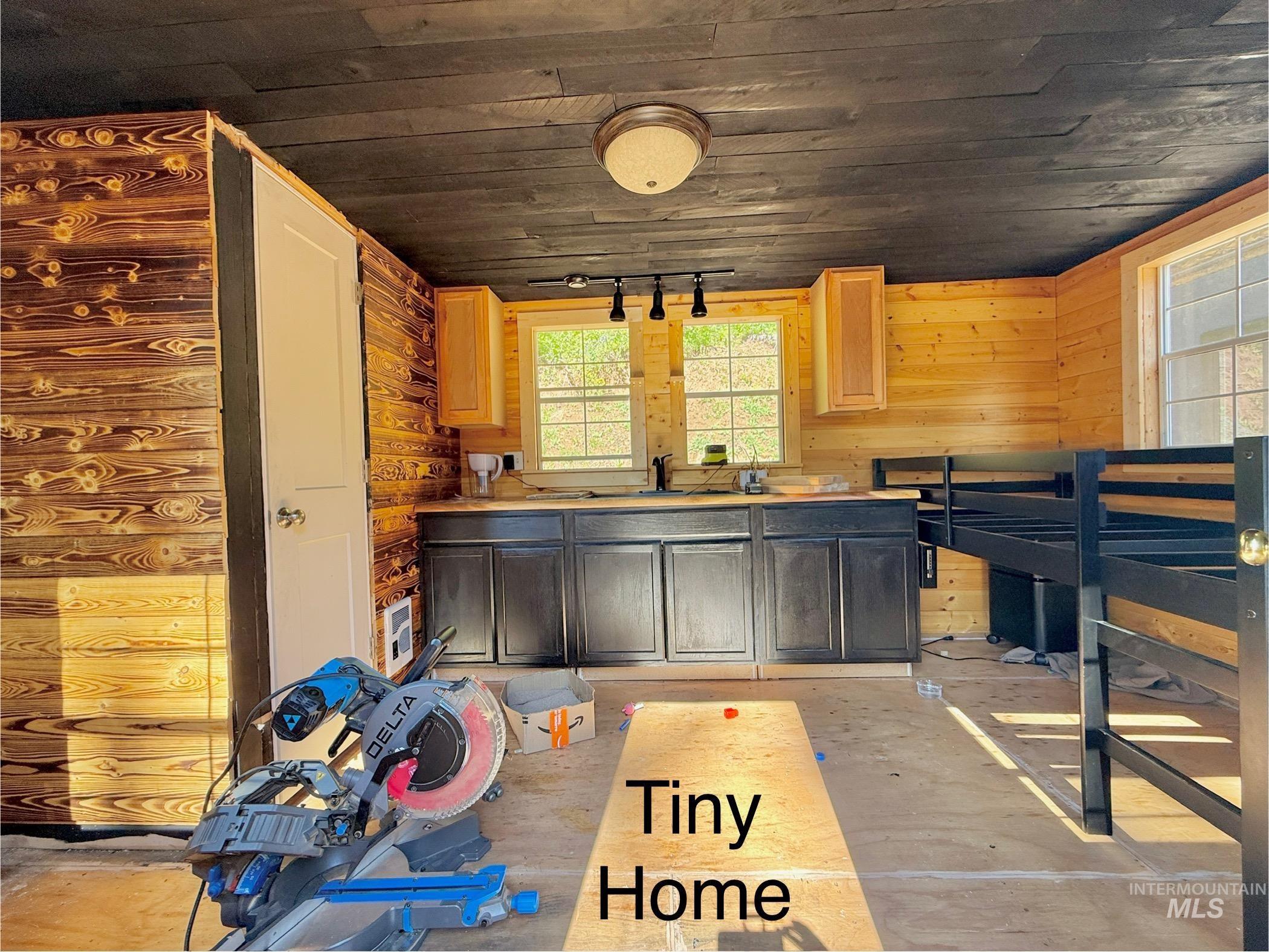Kitchen featuring wooden ceiling and light countertops