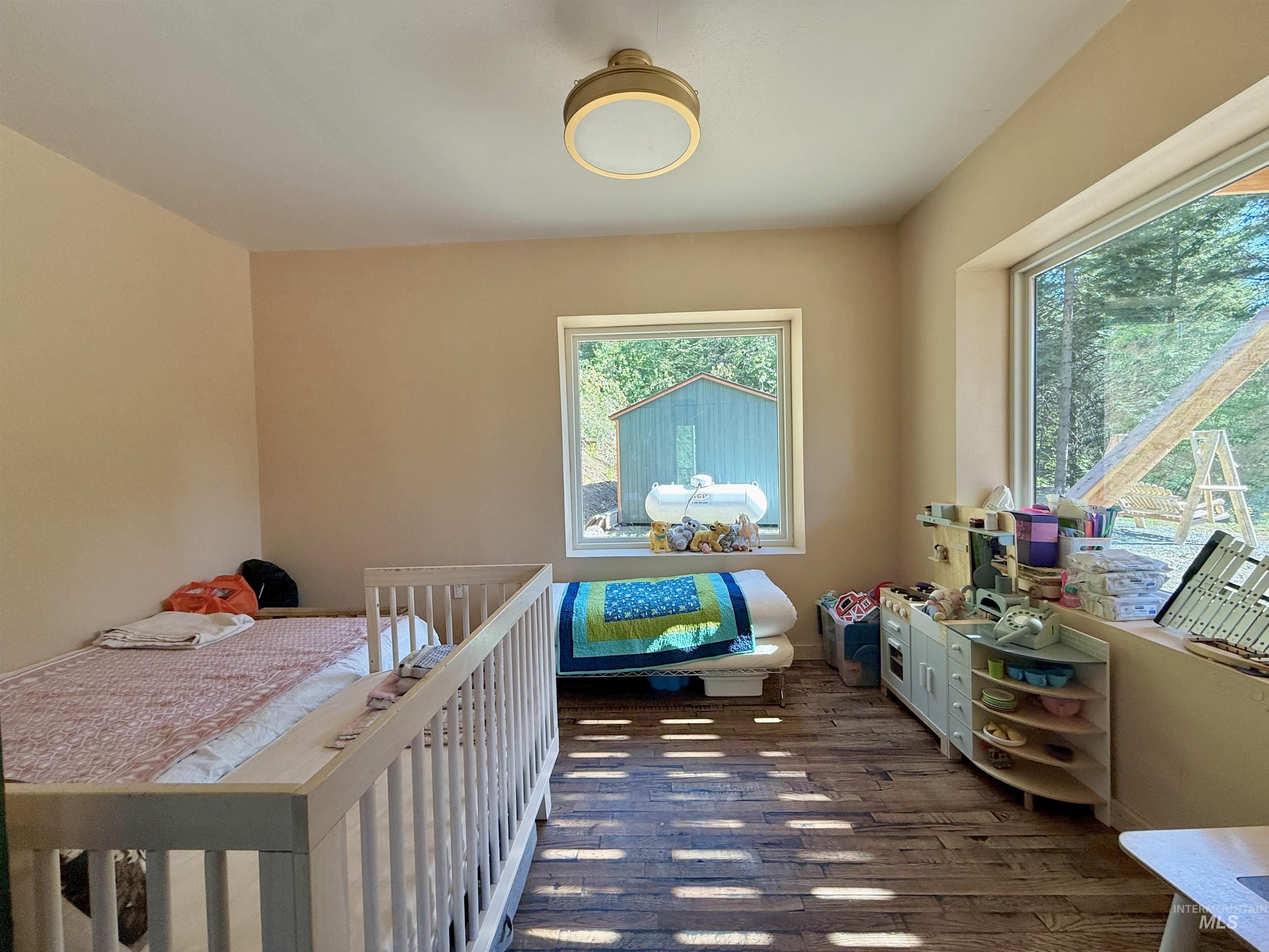 Bedroom with wood finished floors