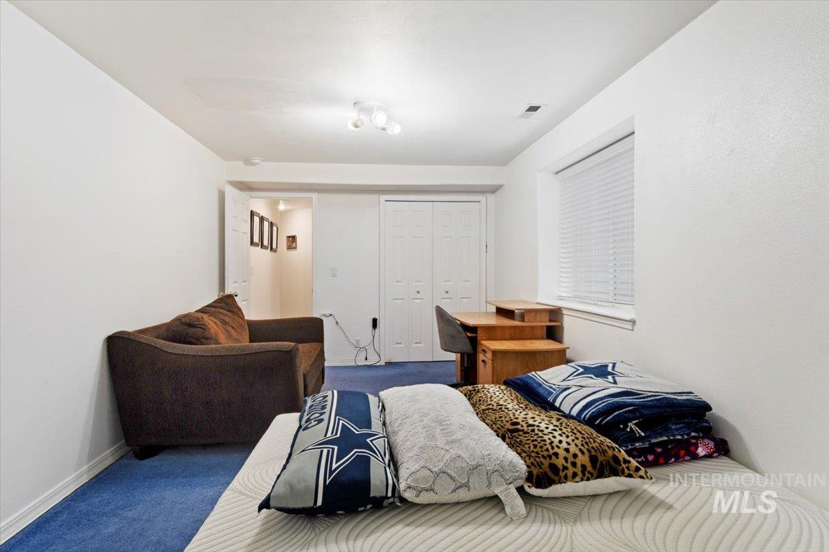 Bedroom with carpet and a closet