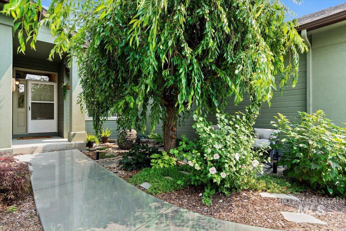 Entrance to property with stucco siding