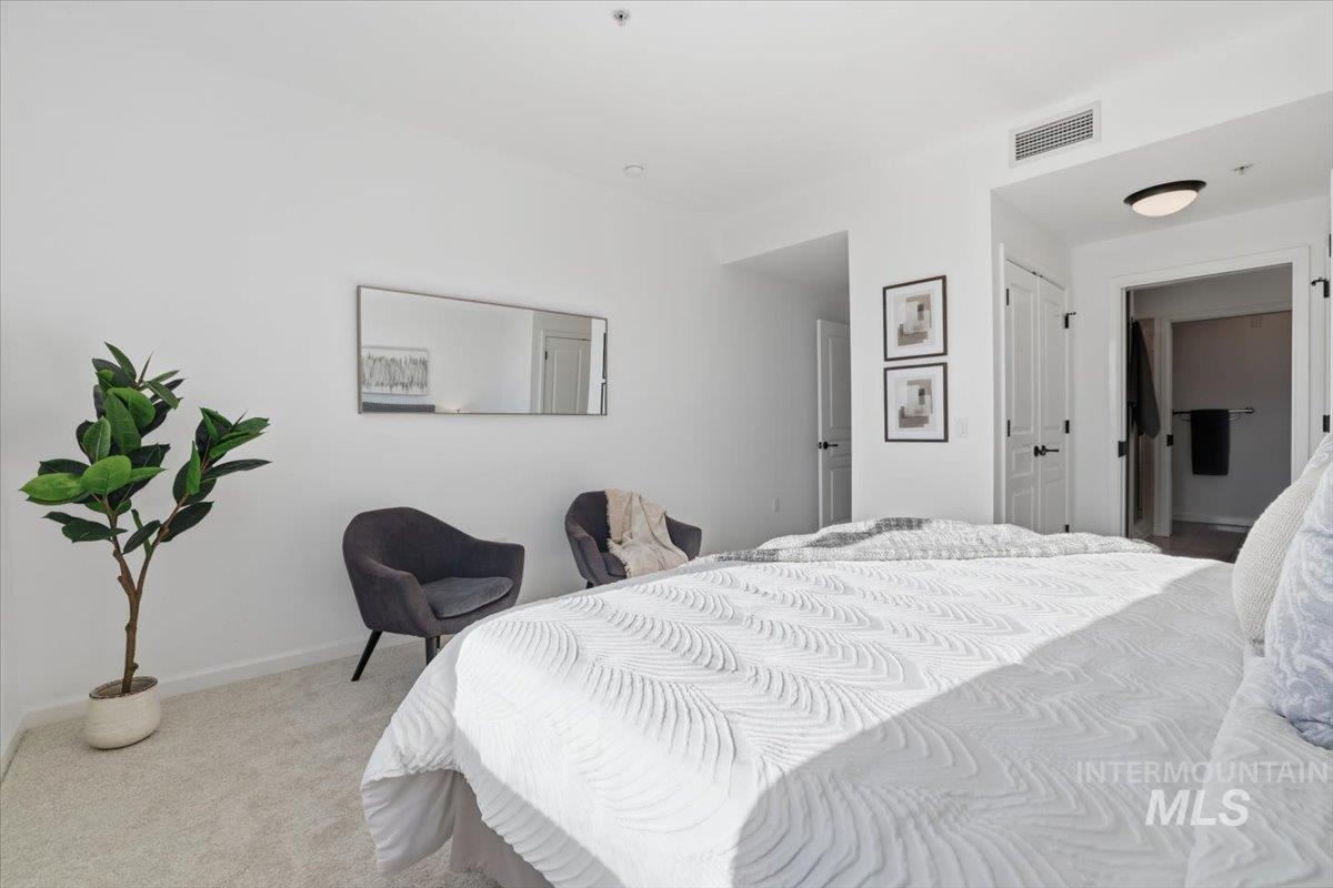 Bedroom with carpet and baseboards