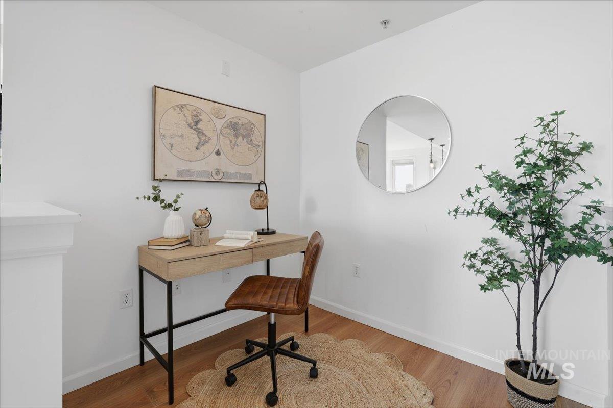 Office area featuring wood finished floors and baseboards