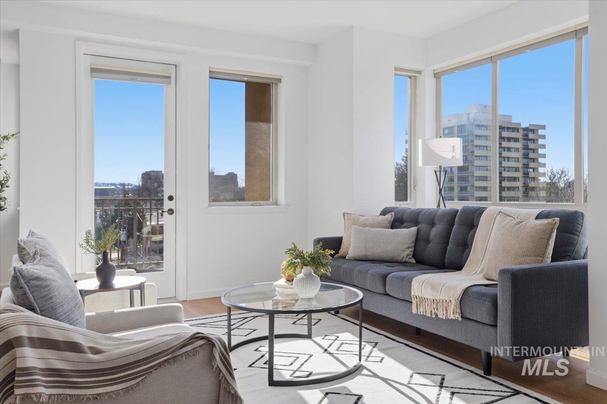 Living room with light wood-style floors and plenty of natural light