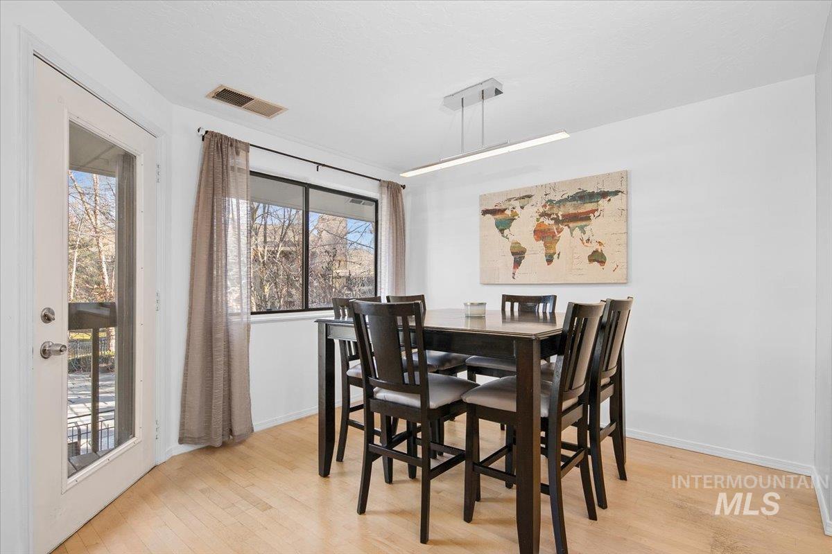 Dining space with light wood finished floors