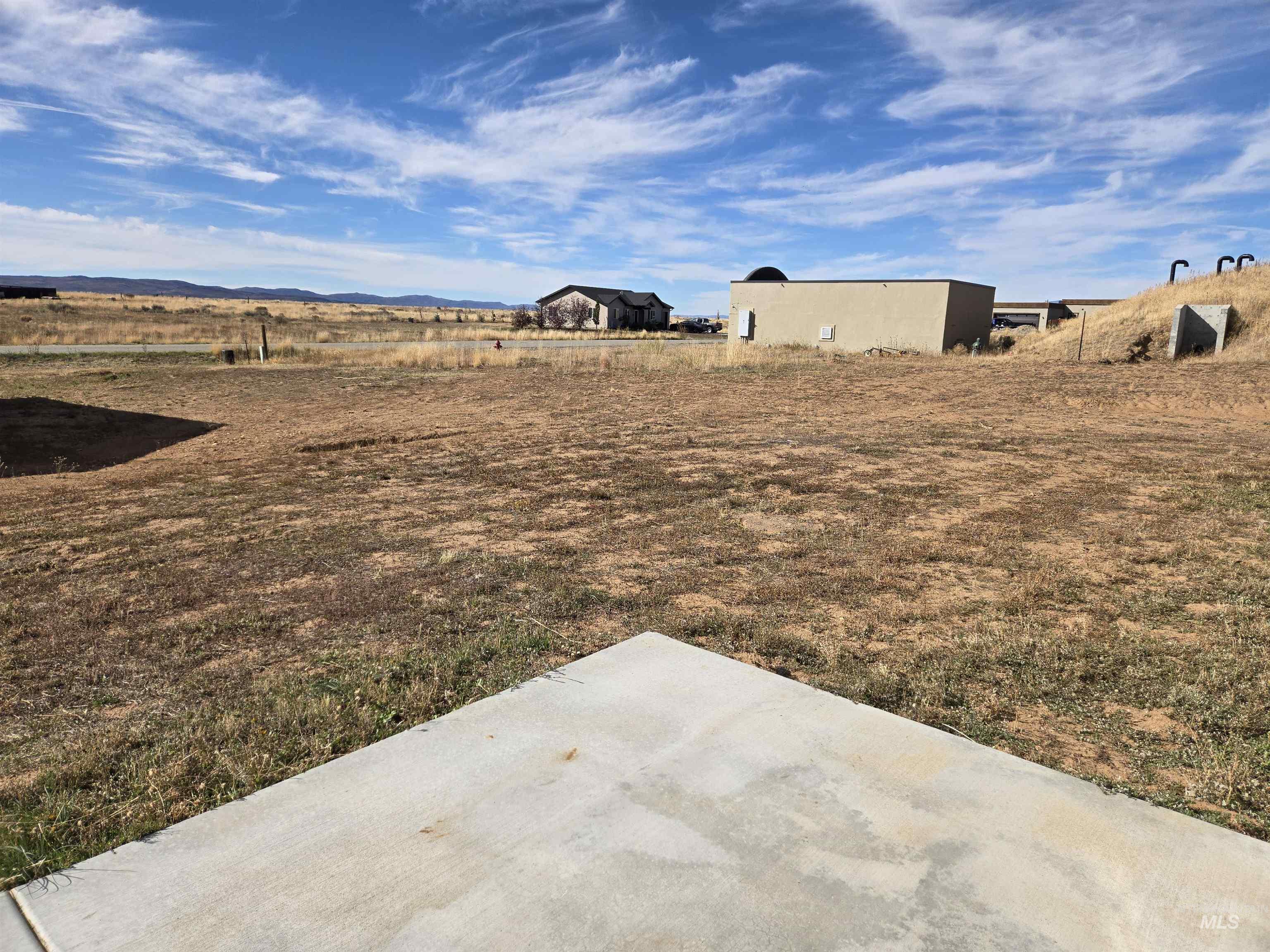 View of yard with a patio and a view of countryside