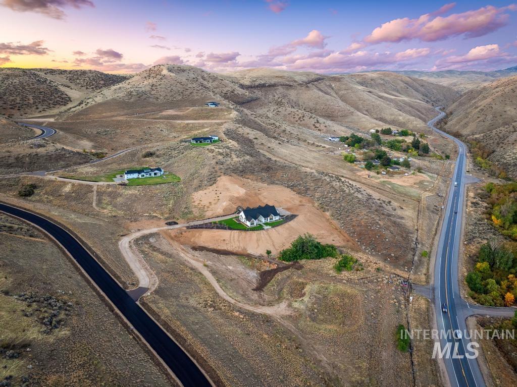 Aerial view at dusk of a view of rural / pastoral area and a mountain view