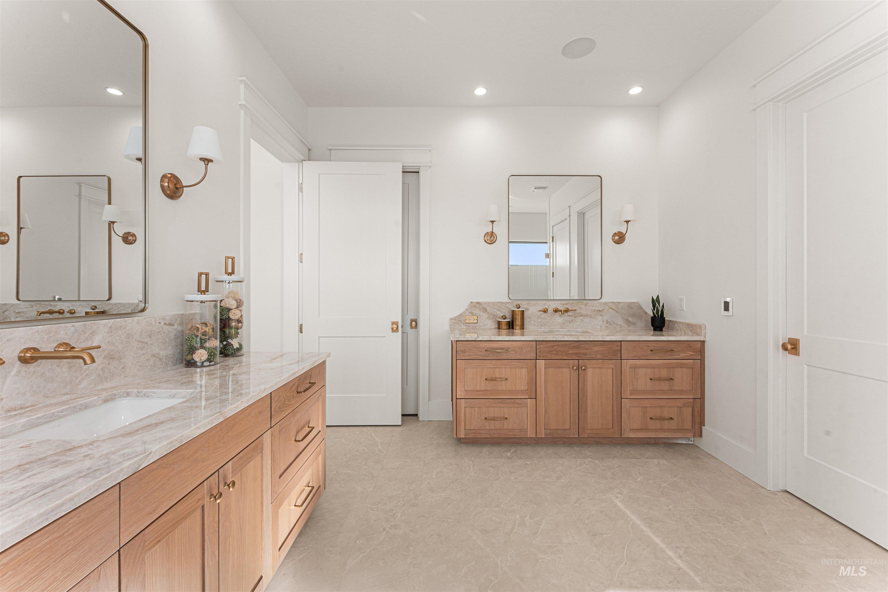 Bathroom with two vanities and recessed lighting