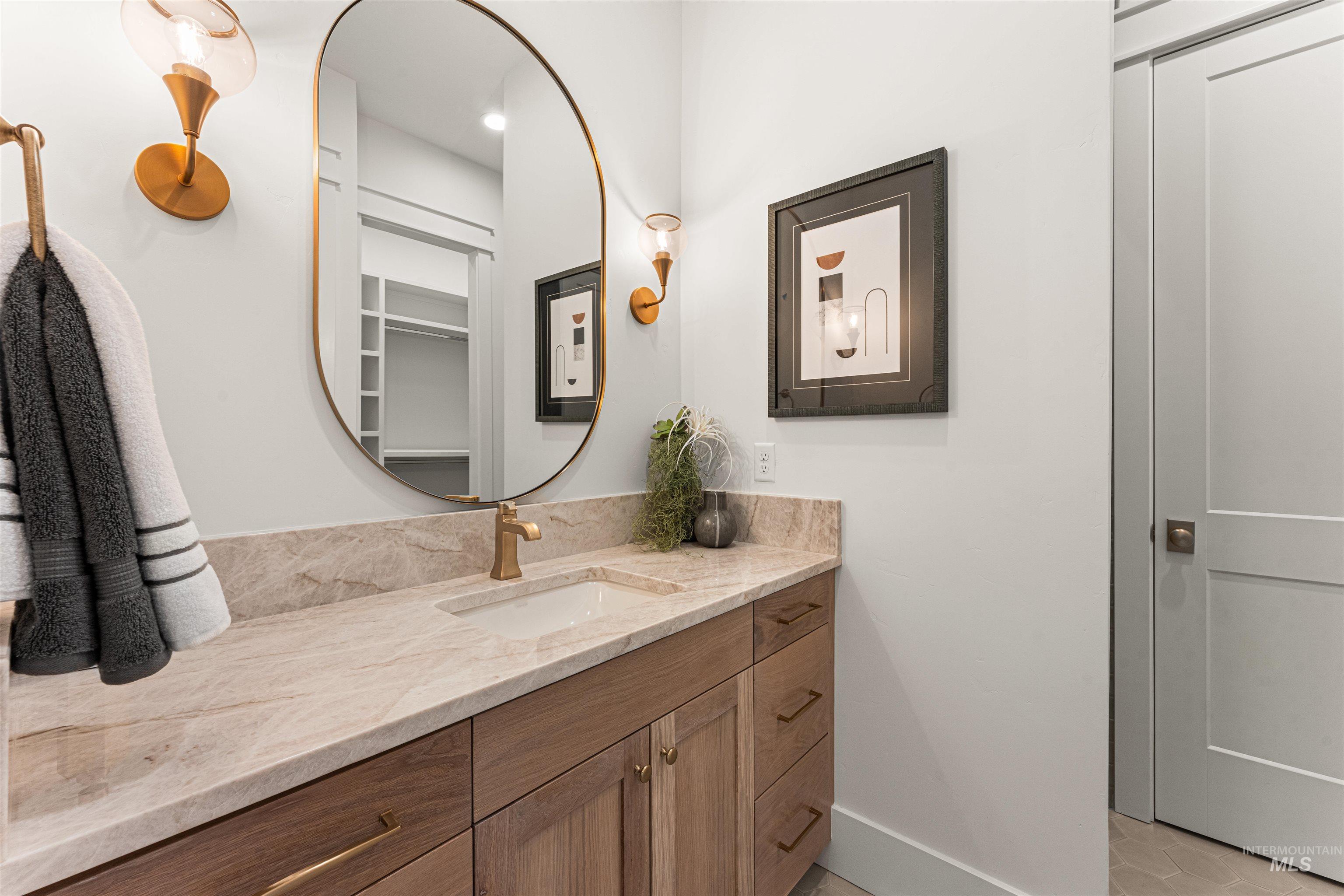 Bathroom featuring vanity and baseboards