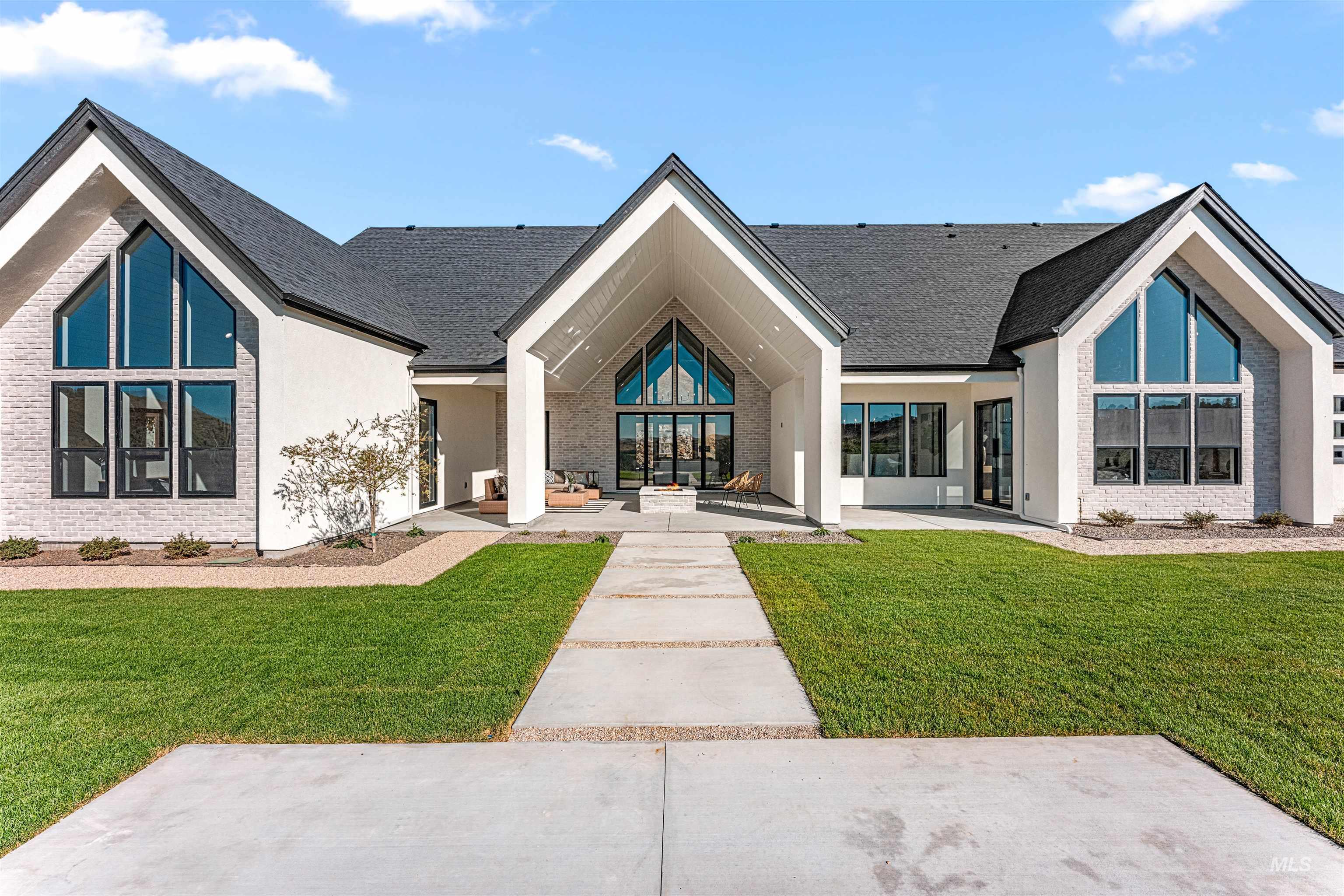 Rear view of property featuring a yard, covered porch, french doors, and roof with shingles