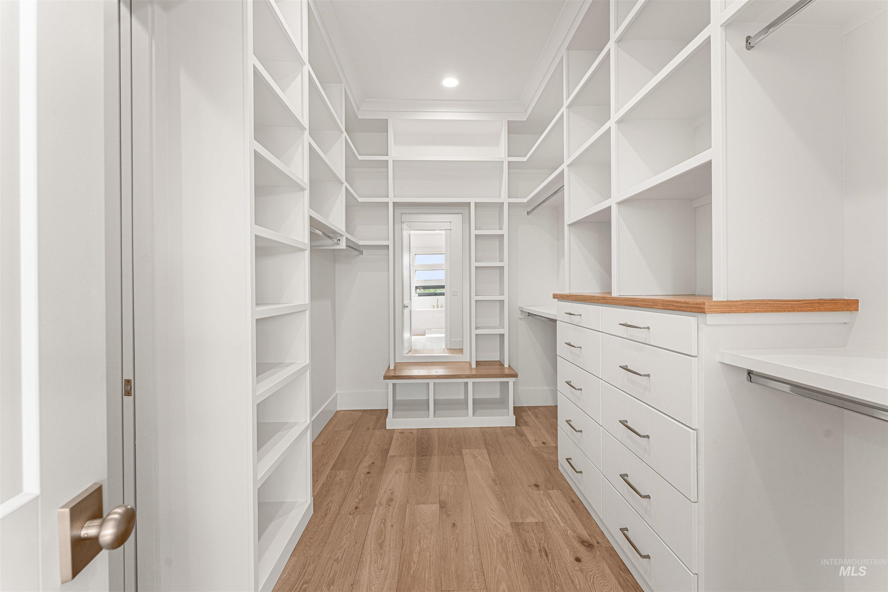 Spacious closet featuring light wood finished floors