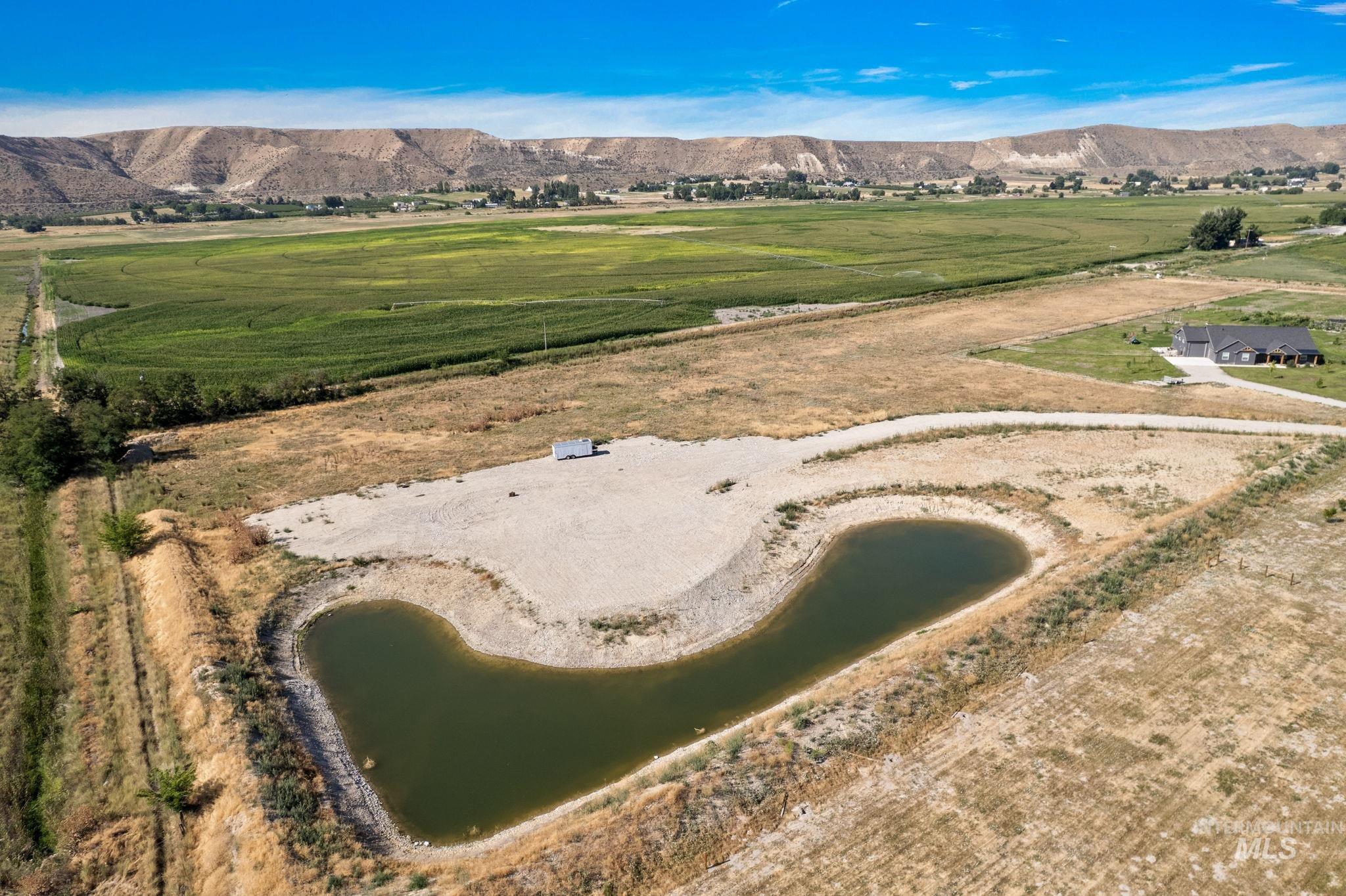 Overview of rural landscape with a water and mountain view