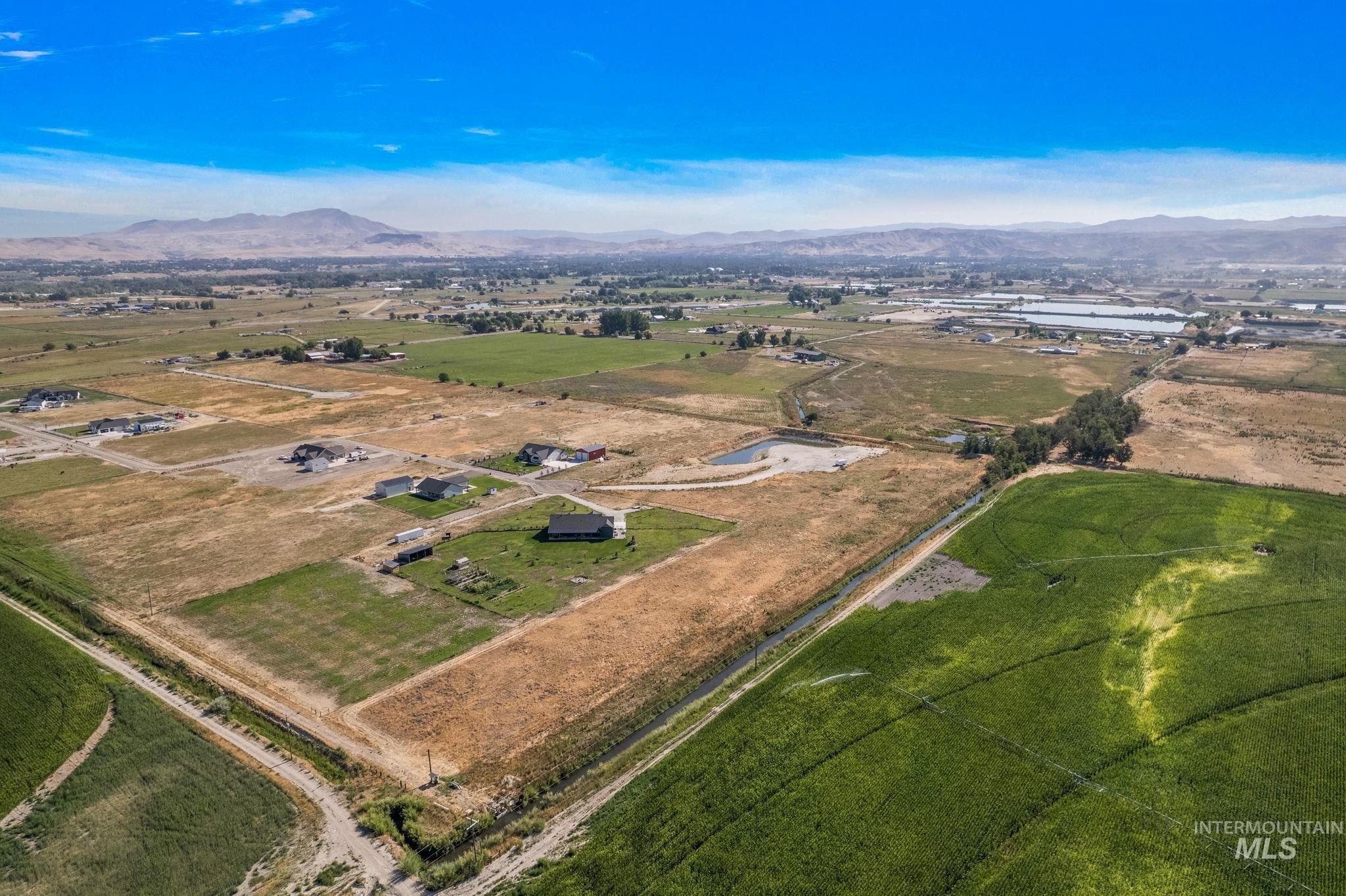 Overview of rural landscape with a mountain backdrop
